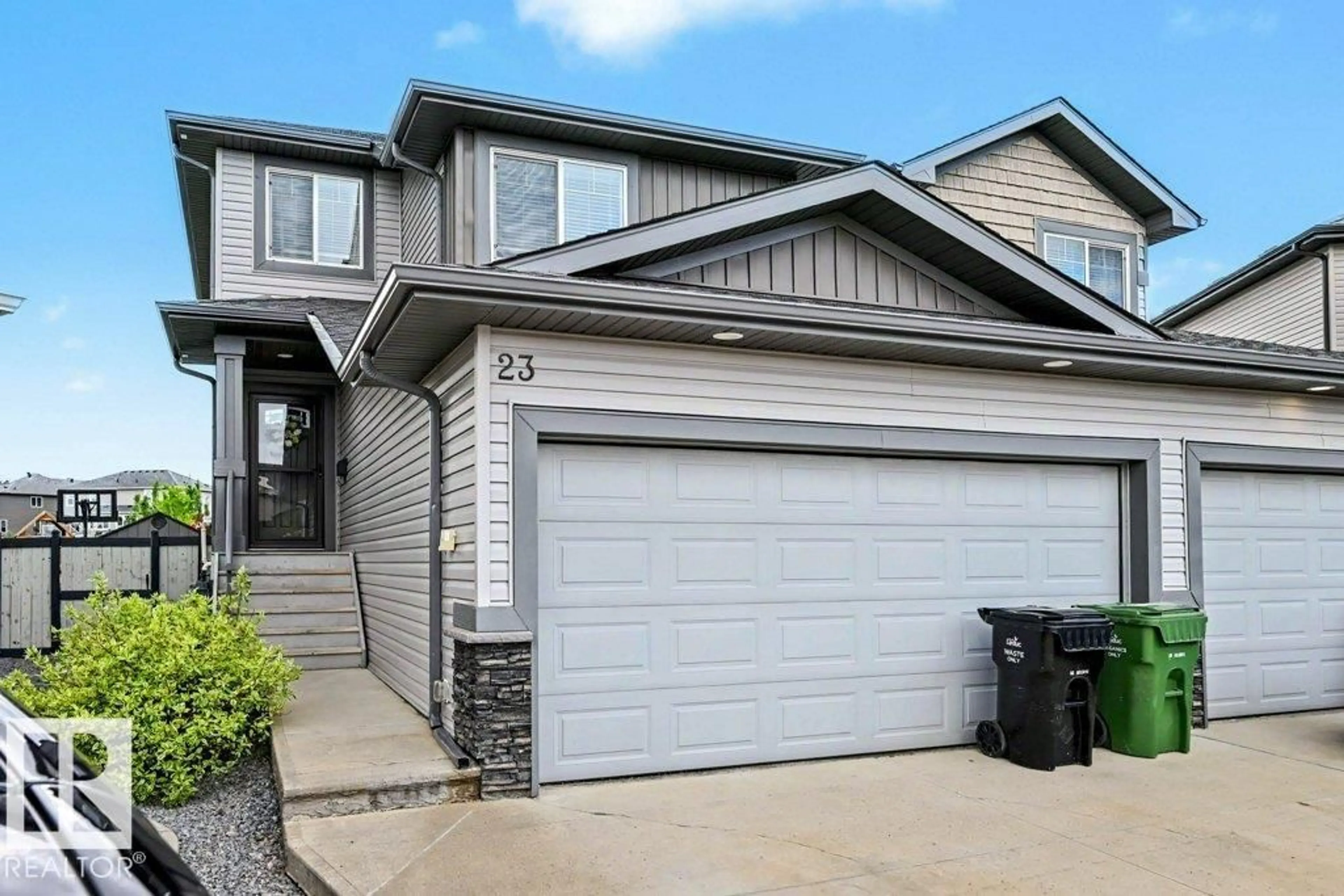 Home with vinyl exterior material, street for 23 MCLEAN, Leduc Alberta T9E1A3