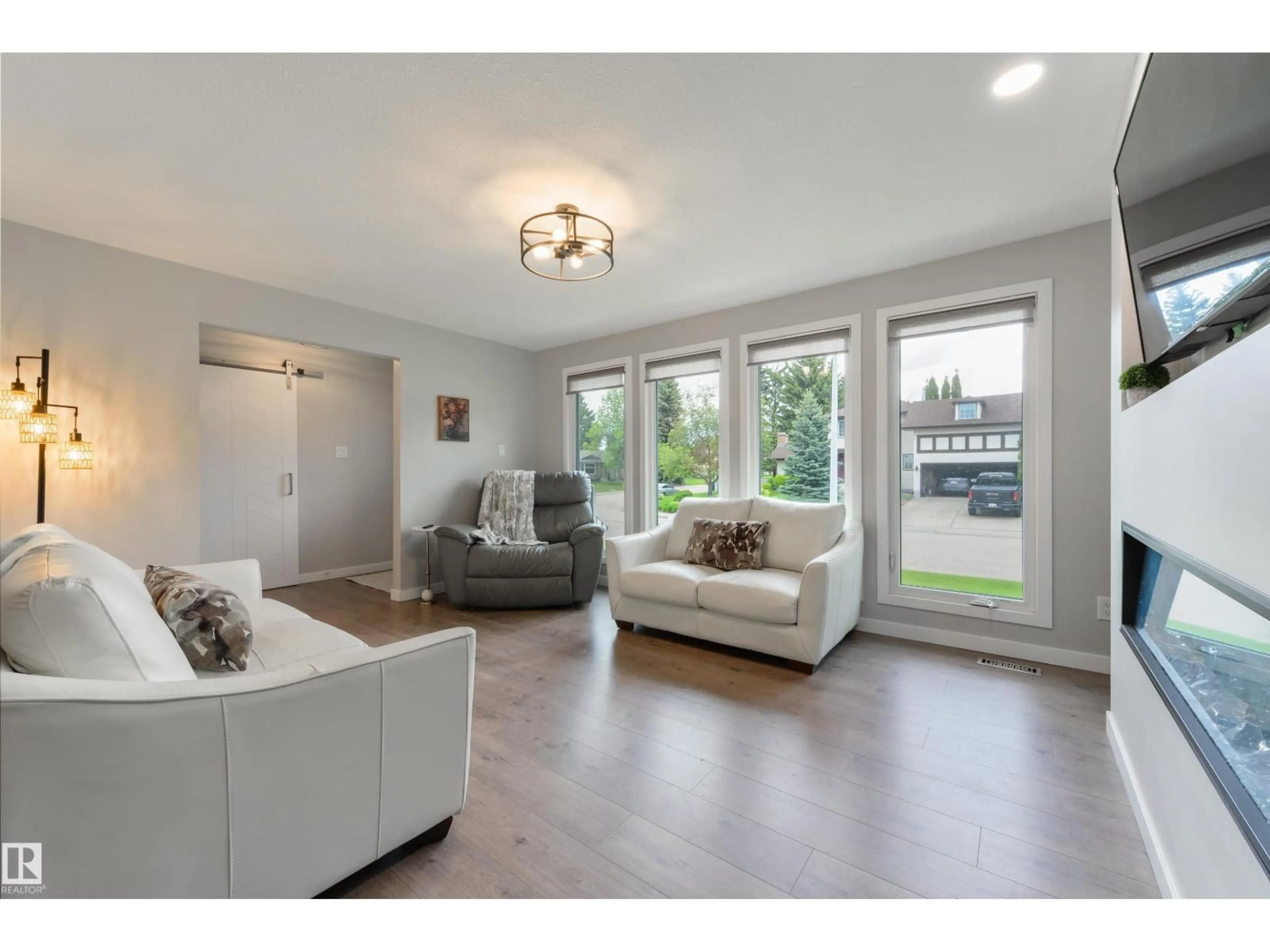 Living room with furniture, wood/laminate floor for 3 MORRIS ST, Spruce Grove Alberta T7X2M5