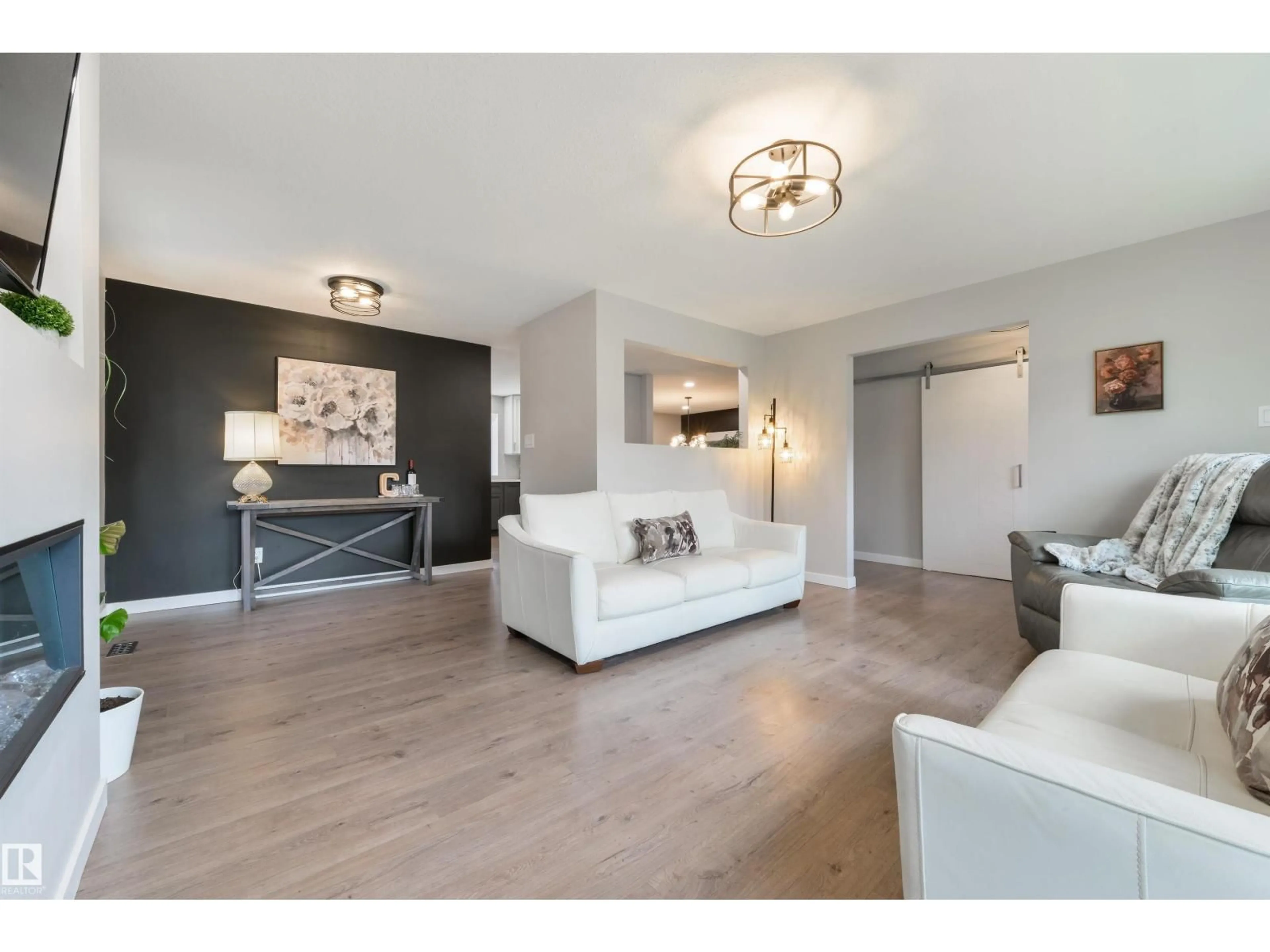 Living room with furniture, wood/laminate floor for 3 MORRIS ST, Spruce Grove Alberta T7X2M5