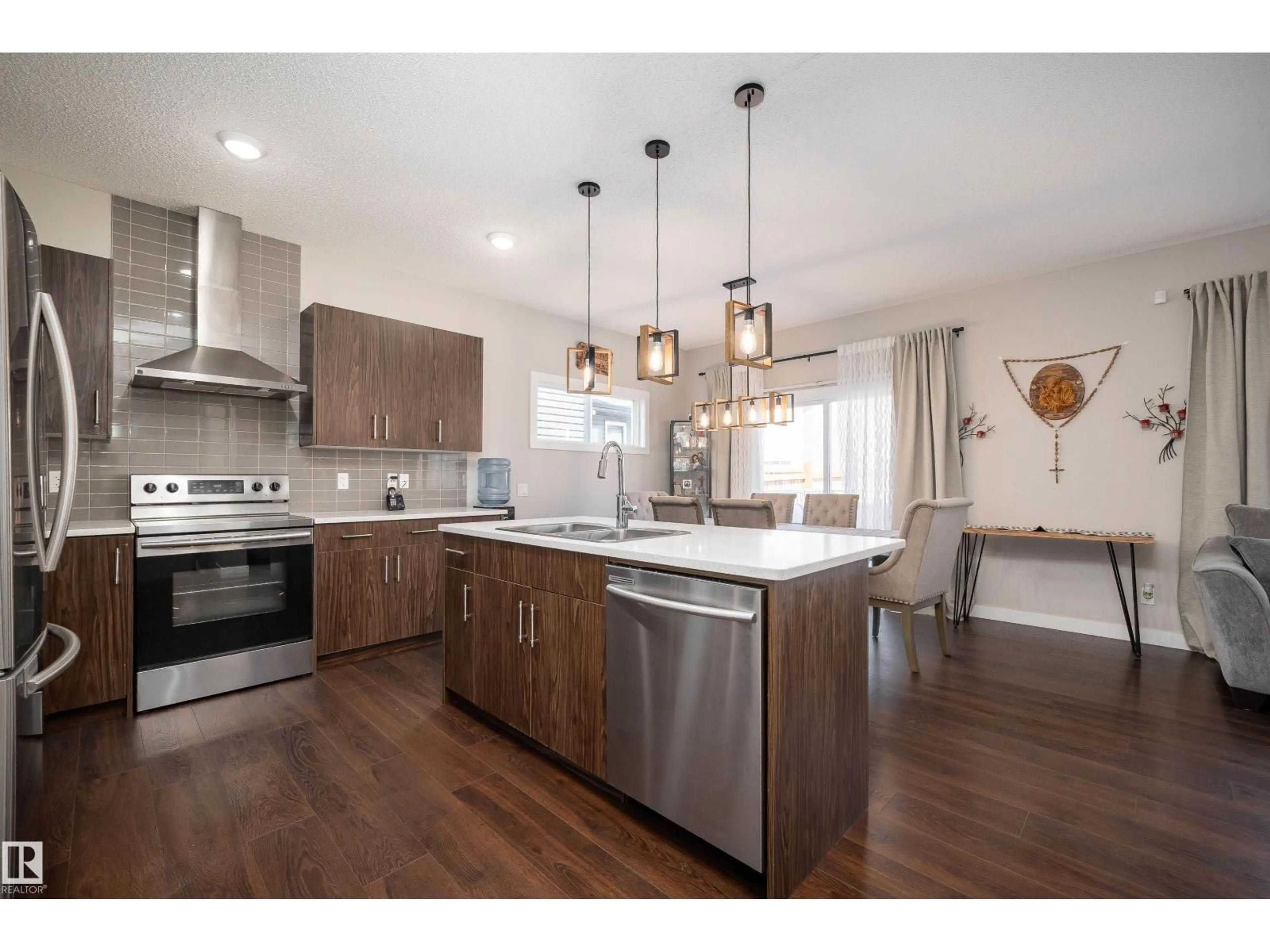 Open concept kitchen, wood/laminate floor for 3222 CHERNOWSKI WY, Edmonton Alberta T6W4G4
