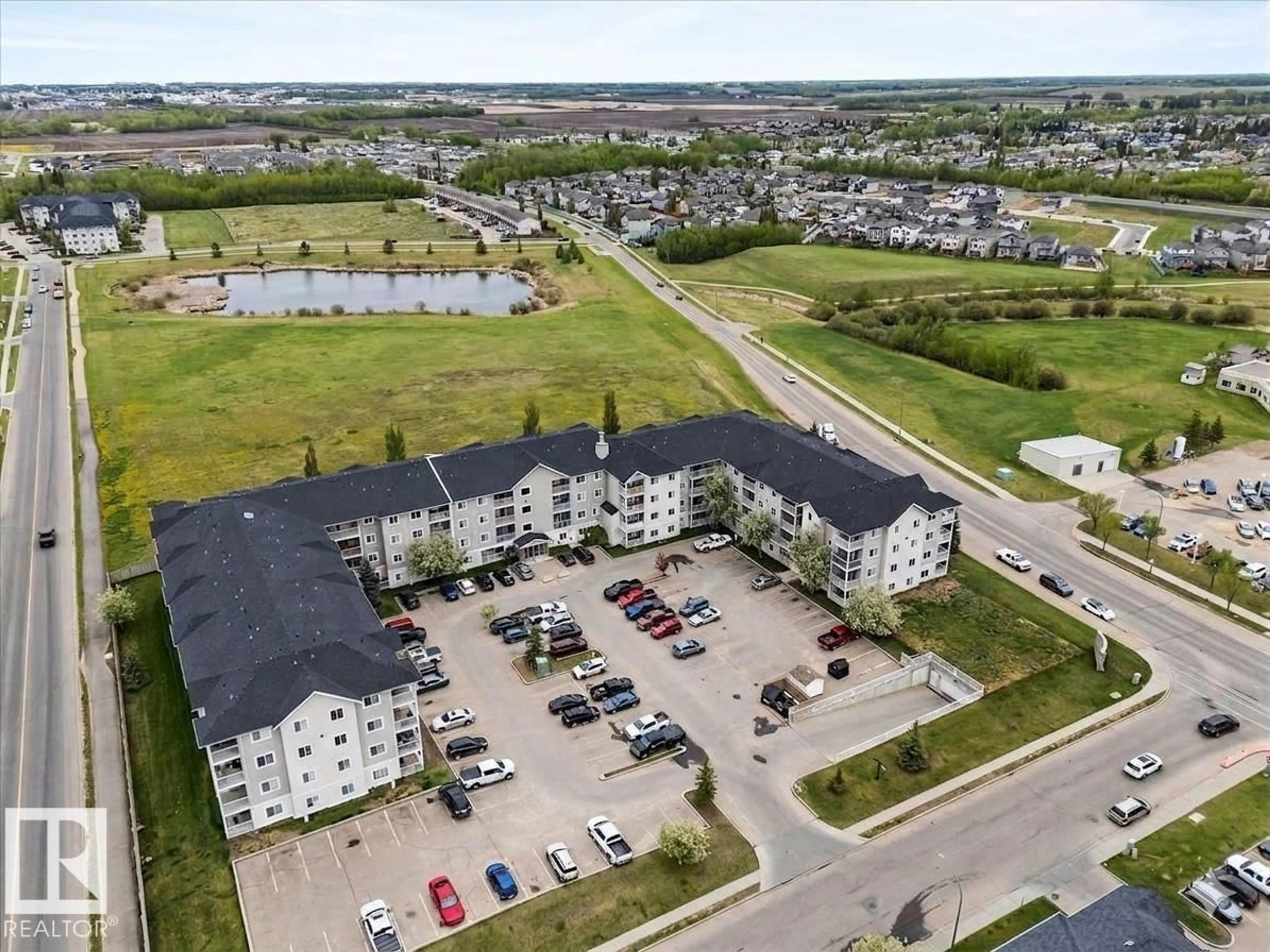 A pic from outside/outdoor area/front of a property/back of a property/a pic from drone, water/lake/river/ocean view for #115 - 4309 33 ST, Stony Plain Alberta T7Z0C4