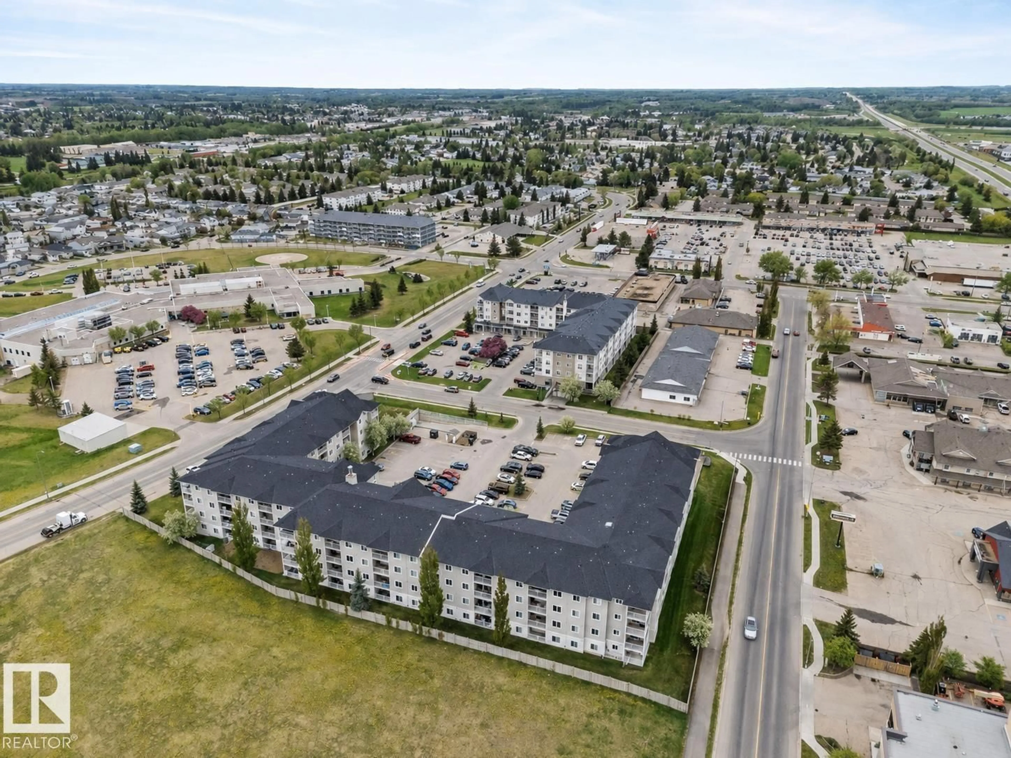 A pic from outside/outdoor area/front of a property/back of a property/a pic from drone, street for #115 - 4309 33 ST, Stony Plain Alberta T7Z0C4