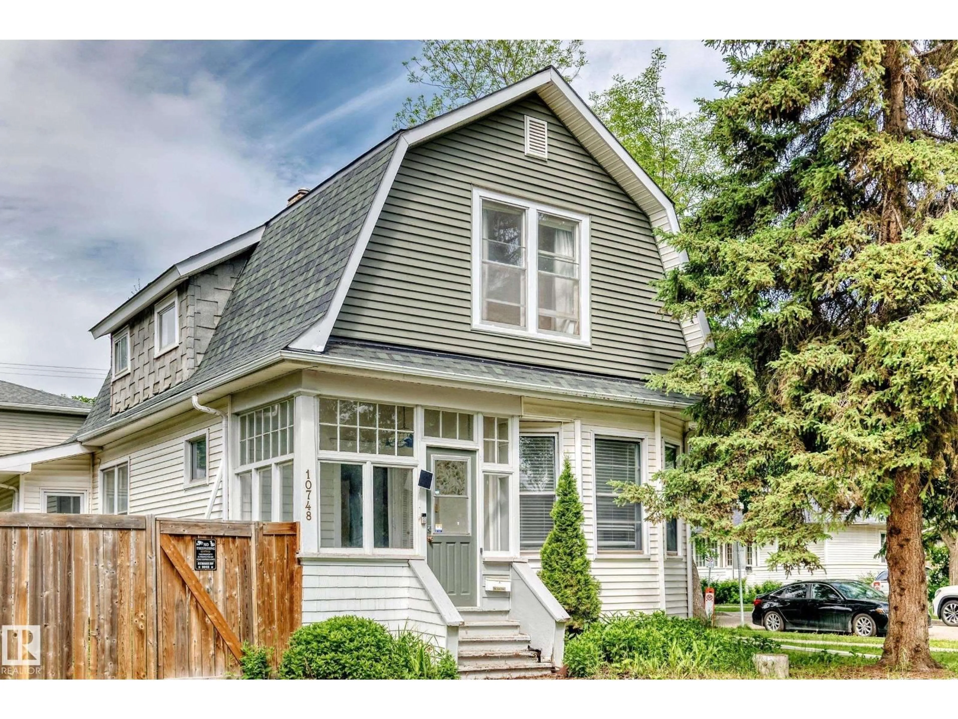 Home with vinyl exterior material, street for 10748 123 ST, Edmonton Alberta T5M0C4