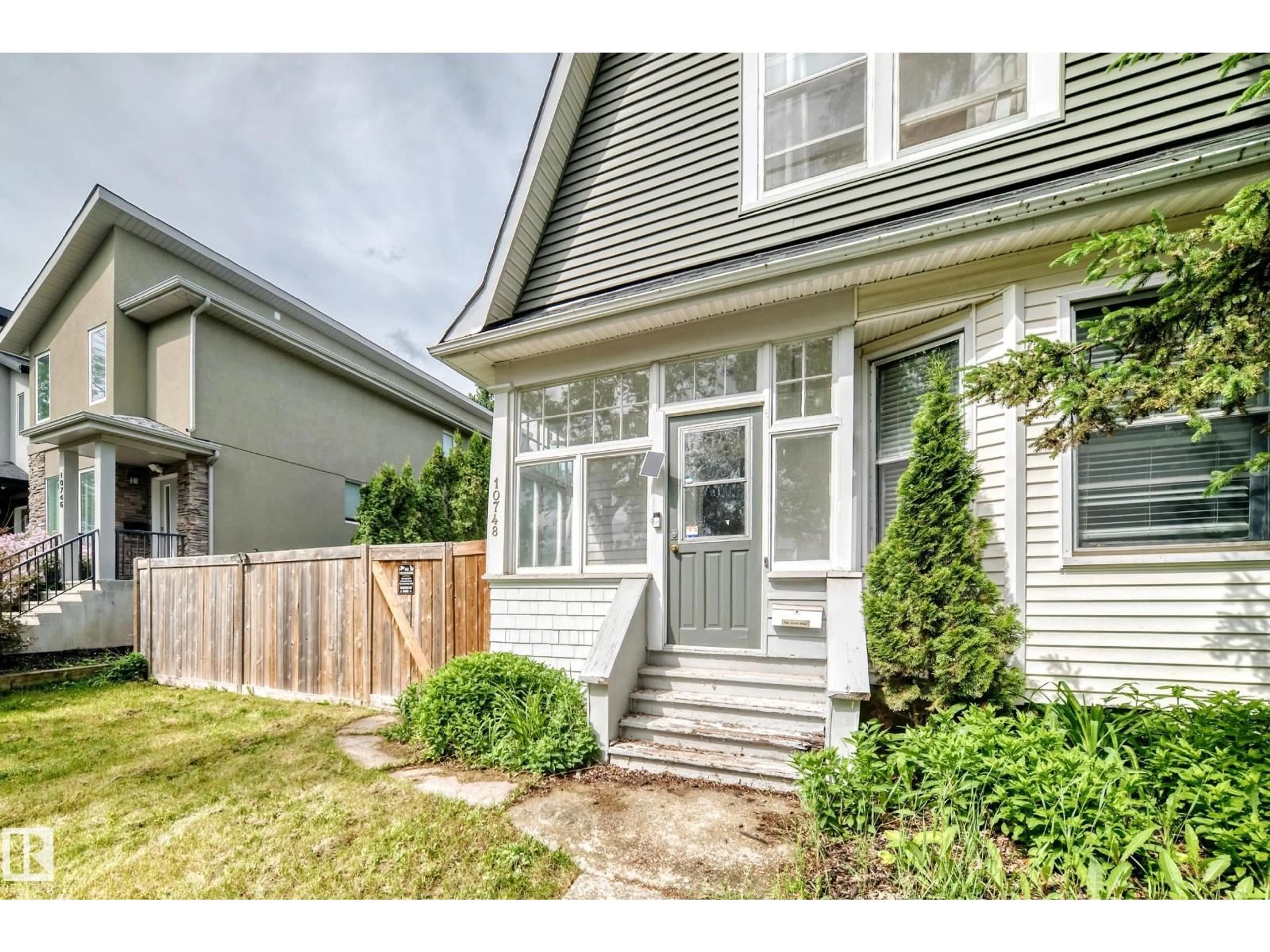 Home with vinyl exterior material, street for 10748 123 ST, Edmonton Alberta T5M0C4