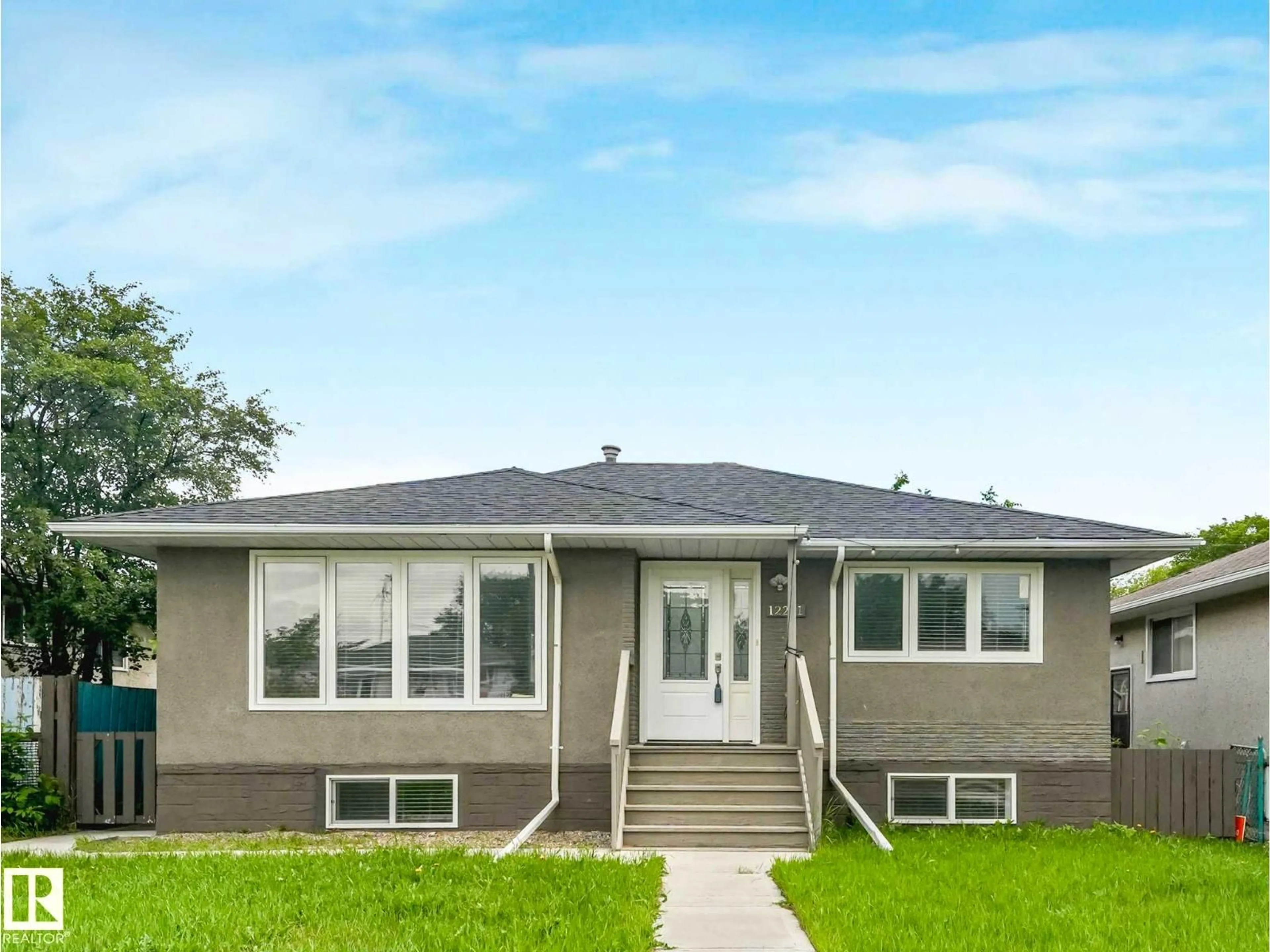 Home with vinyl exterior material, street for NW - 12241 54 ST, Edmonton Alberta T5W3N6