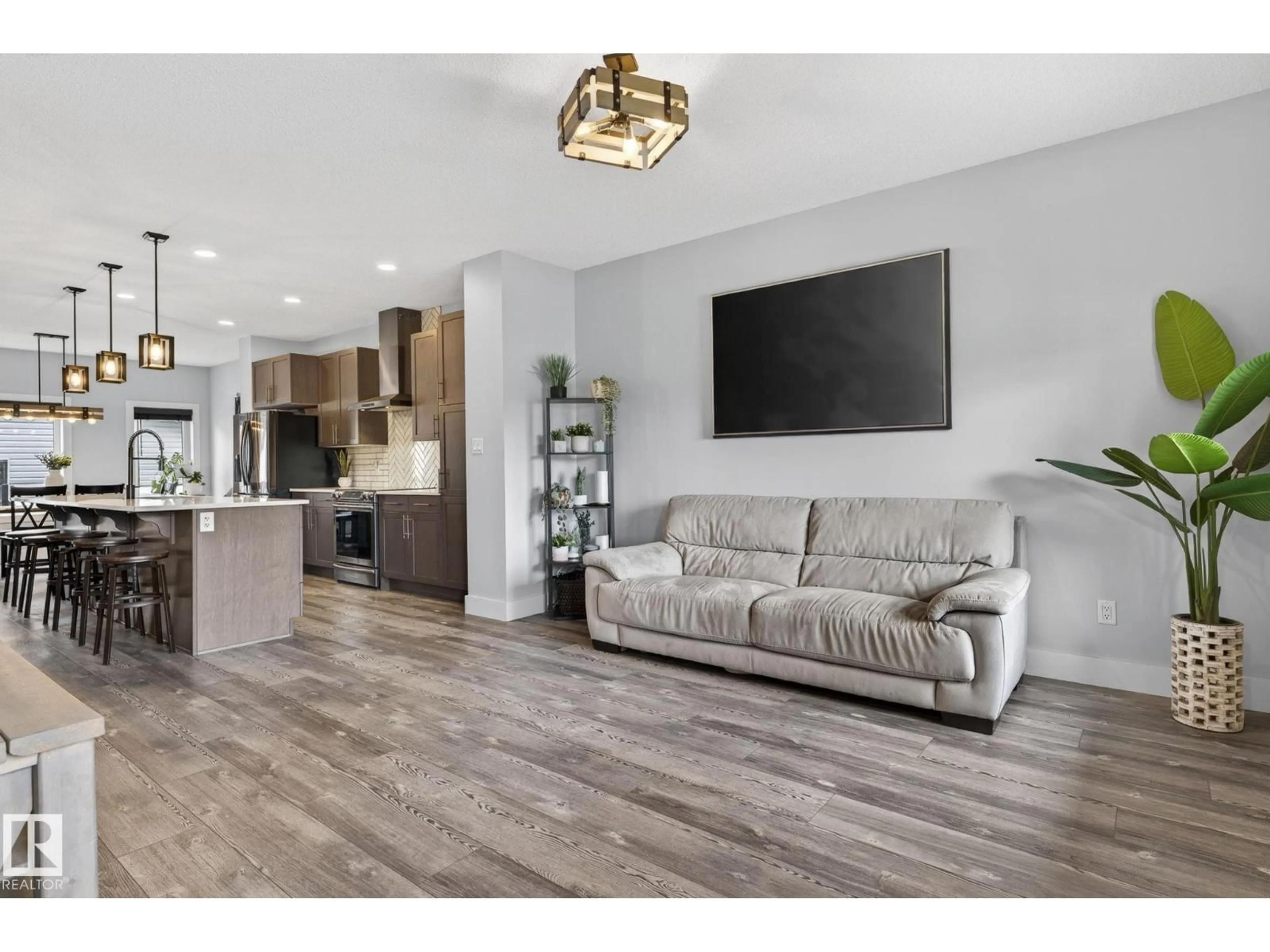 Living room with furniture, wood/laminate floor for 17733 64A ST, Edmonton Alberta T5Y3X4