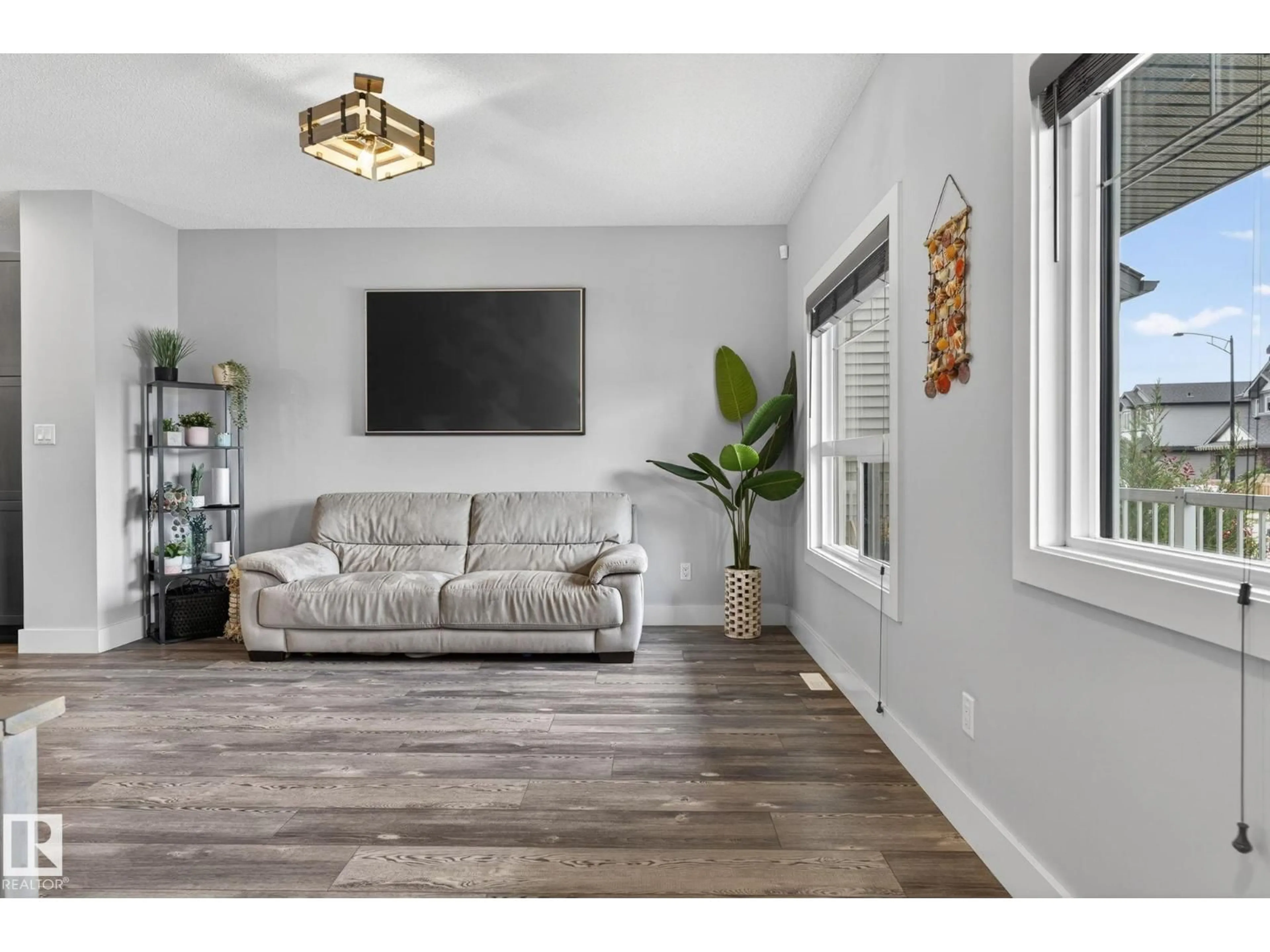 Living room with furniture, wood/laminate floor for 17733 64A ST, Edmonton Alberta T5Y3X4