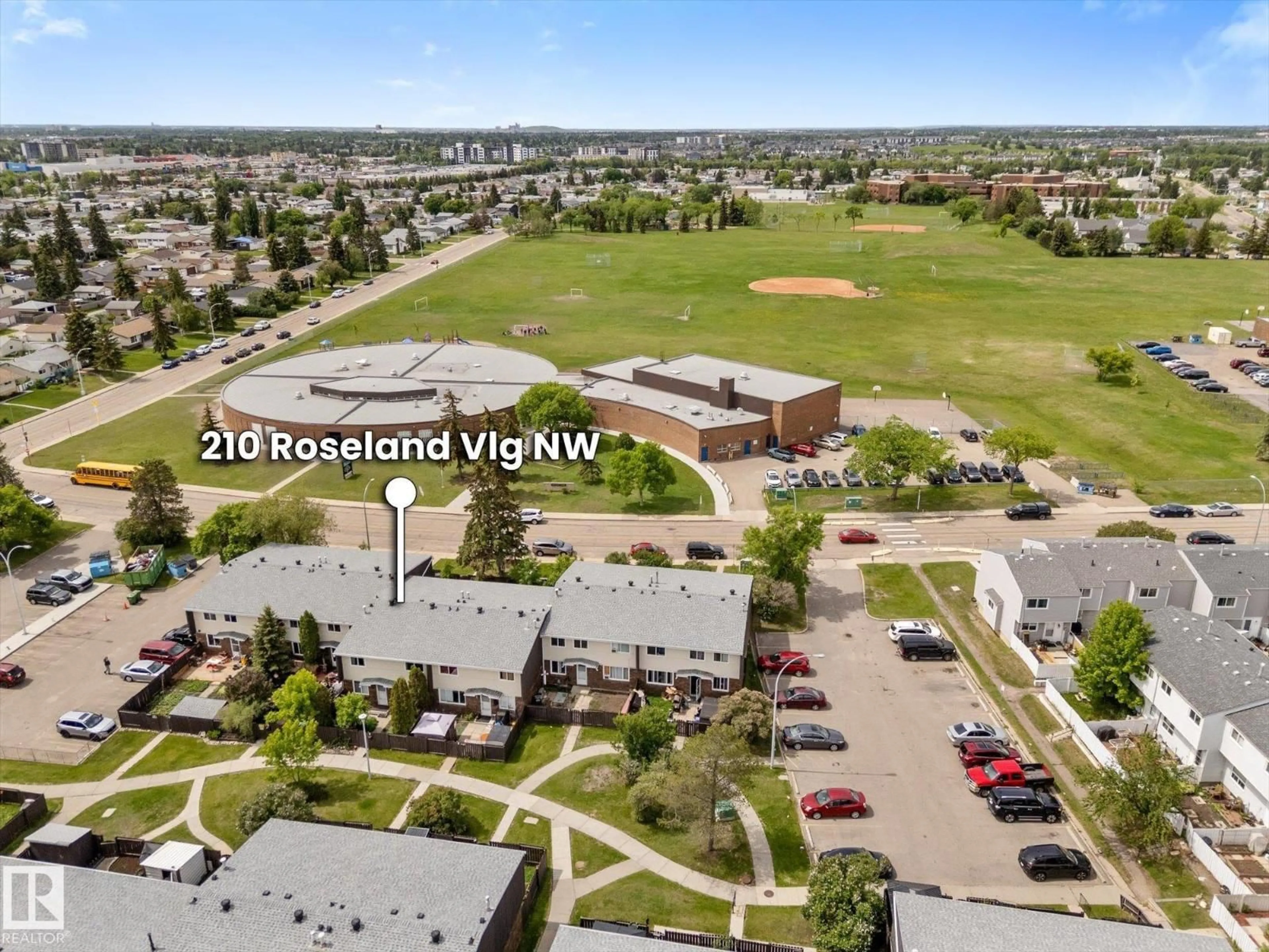 A pic from outside/outdoor area/front of a property/back of a property/a pic from drone, mountain view for NW - 210 ROSELAND VG, Edmonton Alberta T5E5R6