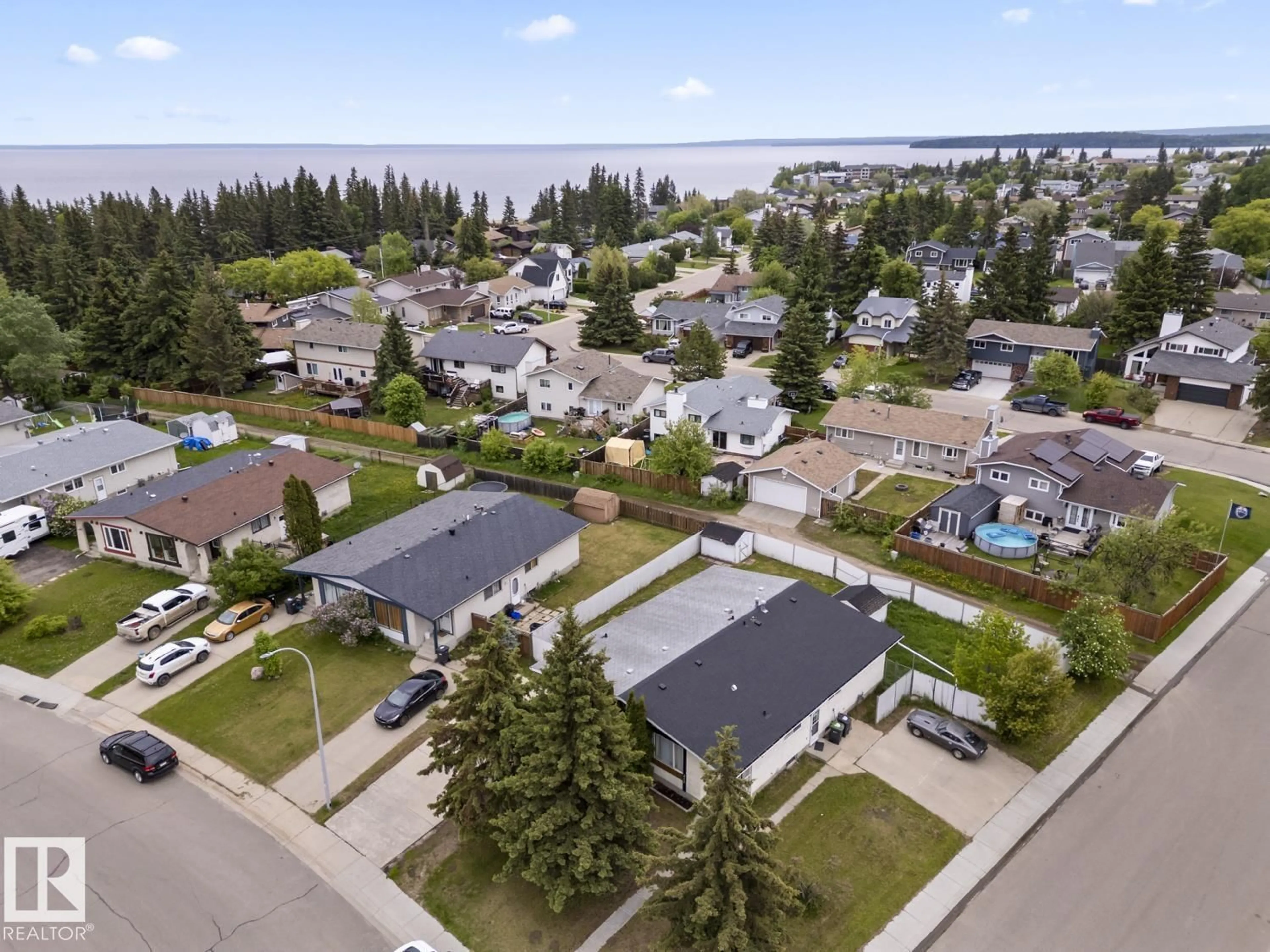 A pic from outside/outdoor area/front of a property/back of a property/a pic from drone, water/lake/river/ocean view for 210 22 ST, Cold Lake Alberta T9M1E7