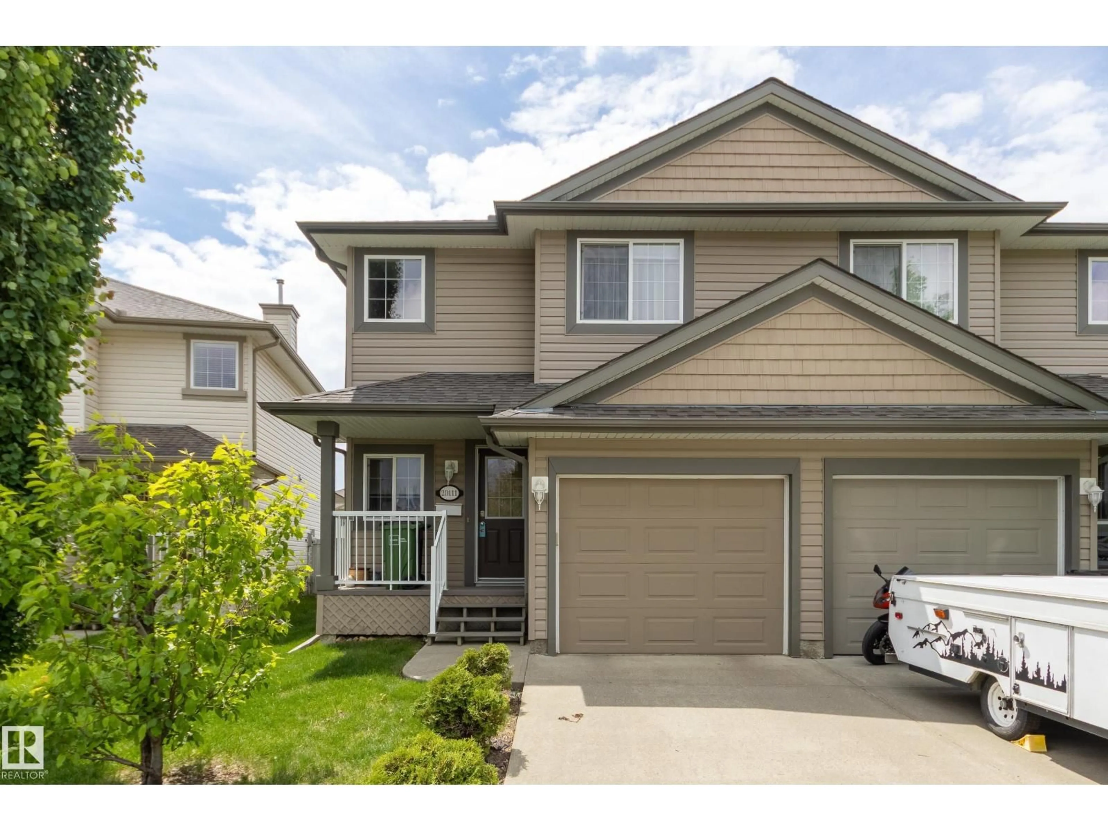 Home with vinyl exterior material, street for 20111 56 AV, Edmonton Alberta T6M0B3
