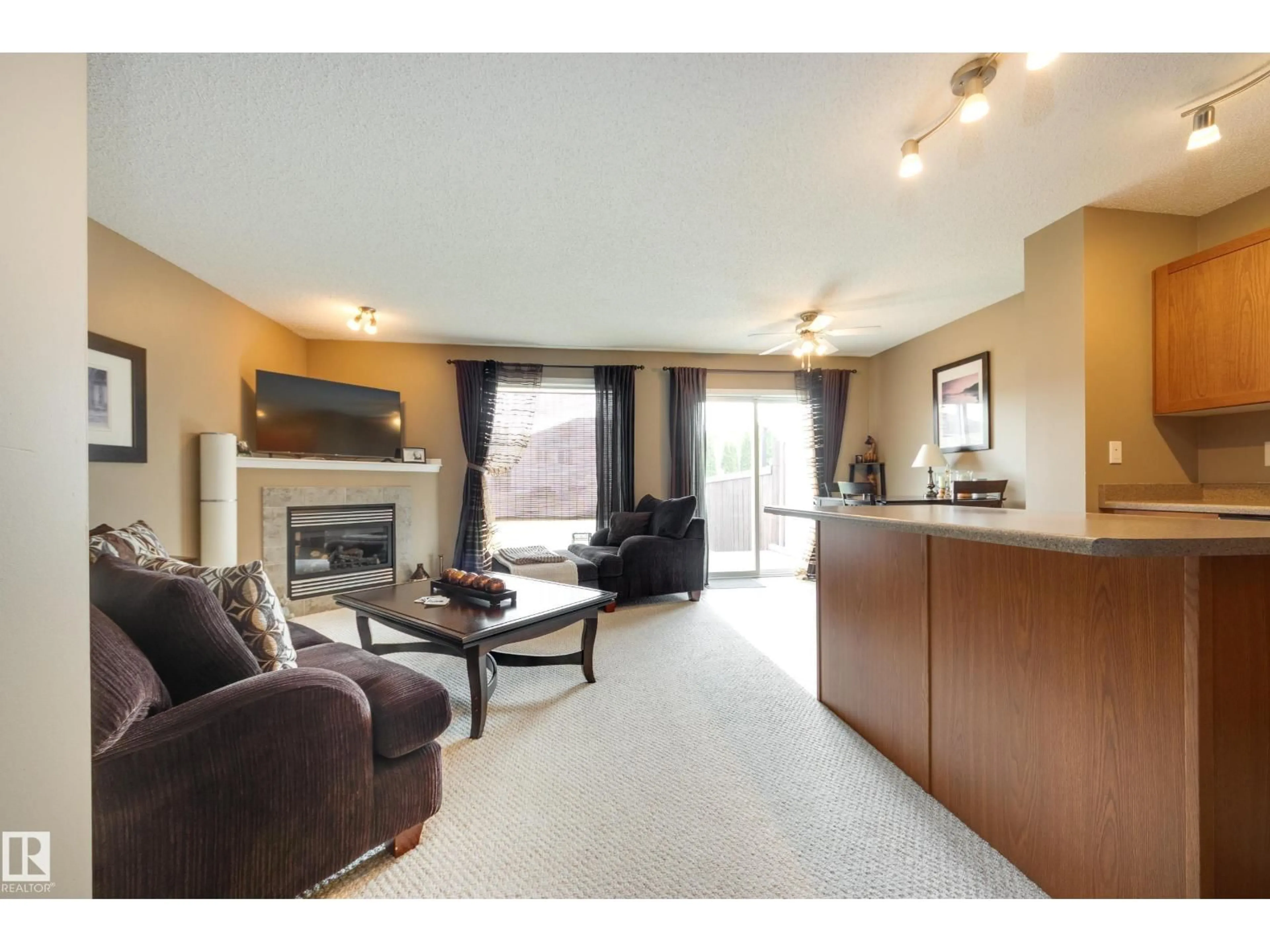 Living room with furniture, wood/laminate floor for 20111 56 AV, Edmonton Alberta T6M0B3