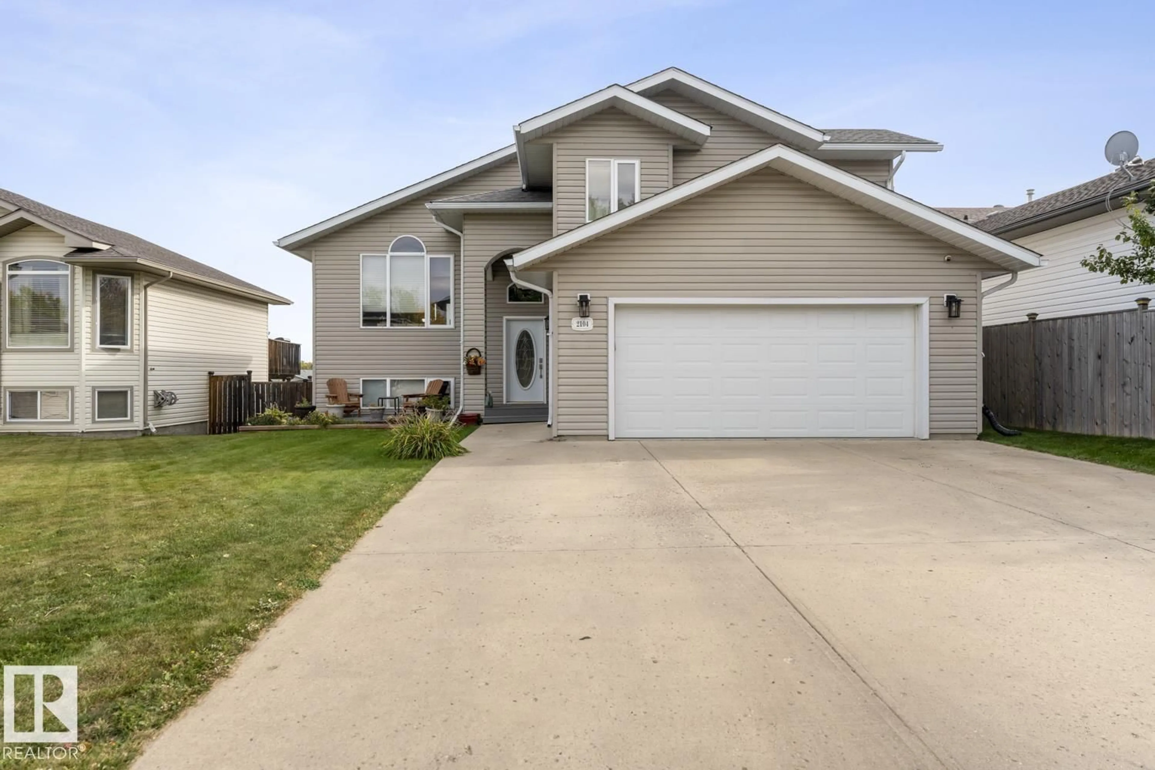 Home with vinyl exterior material, street for 2104 7 ST, Cold Lake Alberta T9M2B9