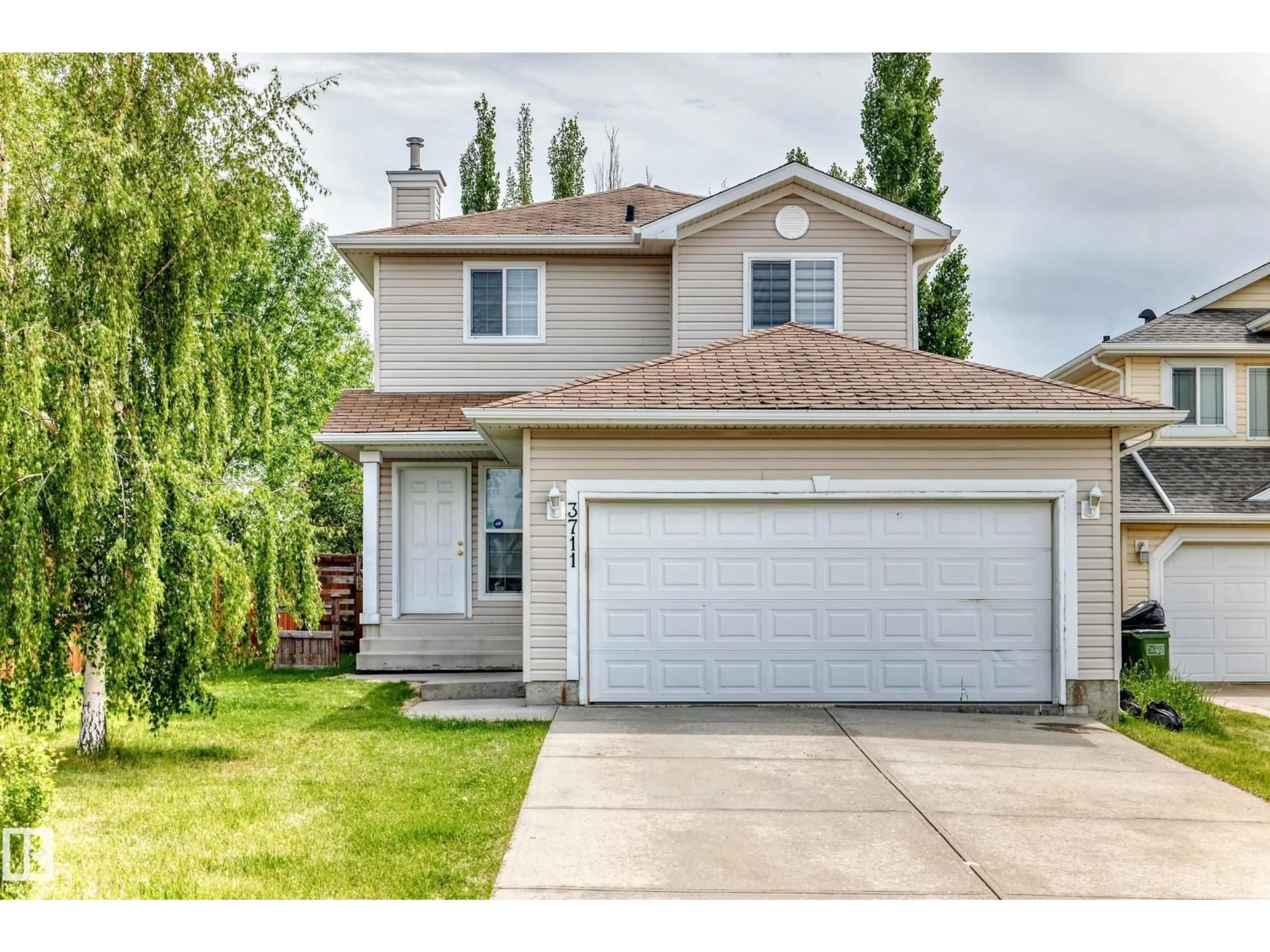 Home with vinyl exterior material, street for NW - 3711 22A ST, Edmonton Alberta T6T1V7