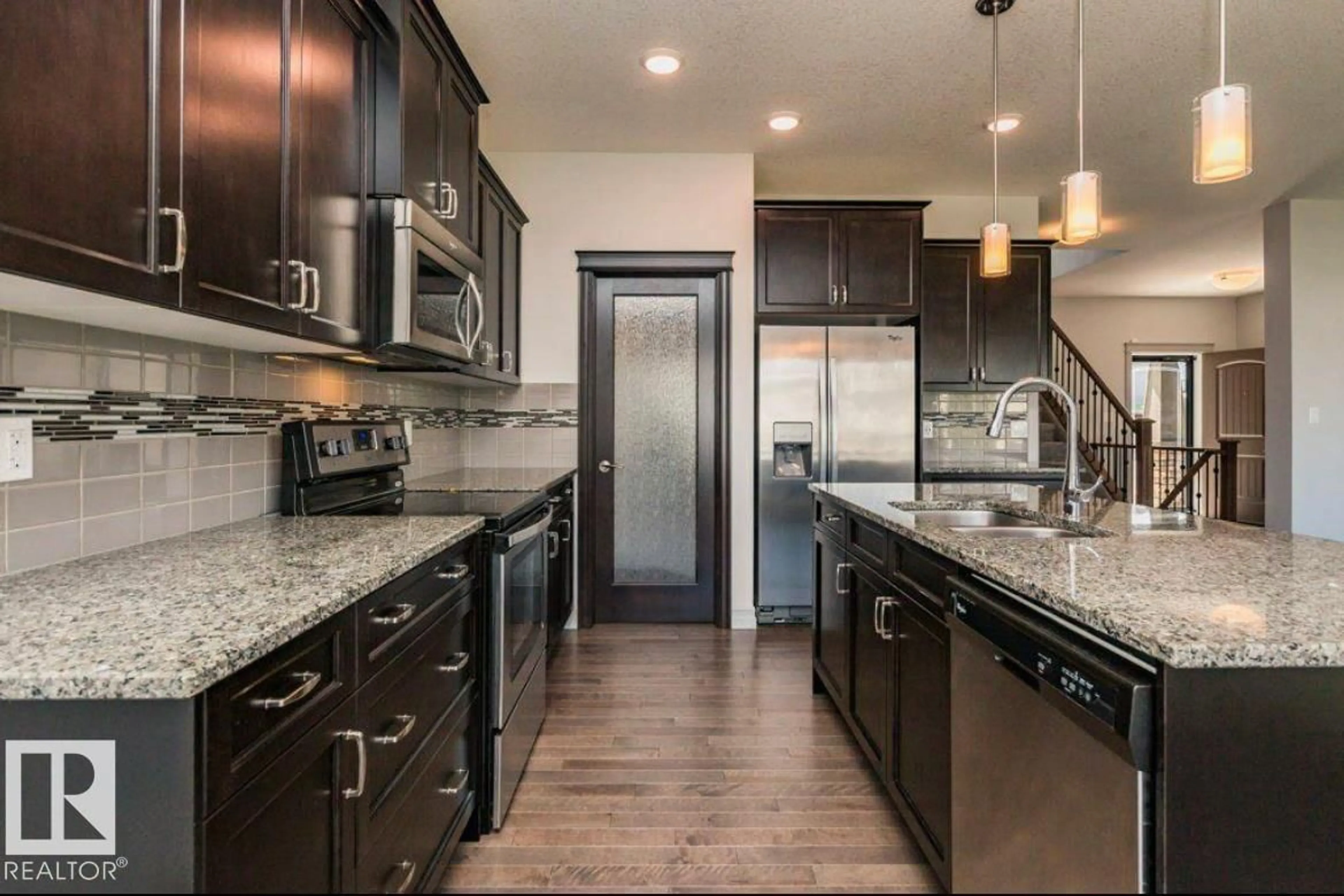 Open concept kitchen, ceramic/tile floor for 5912 19 AV, Edmonton Alberta T6X2A2