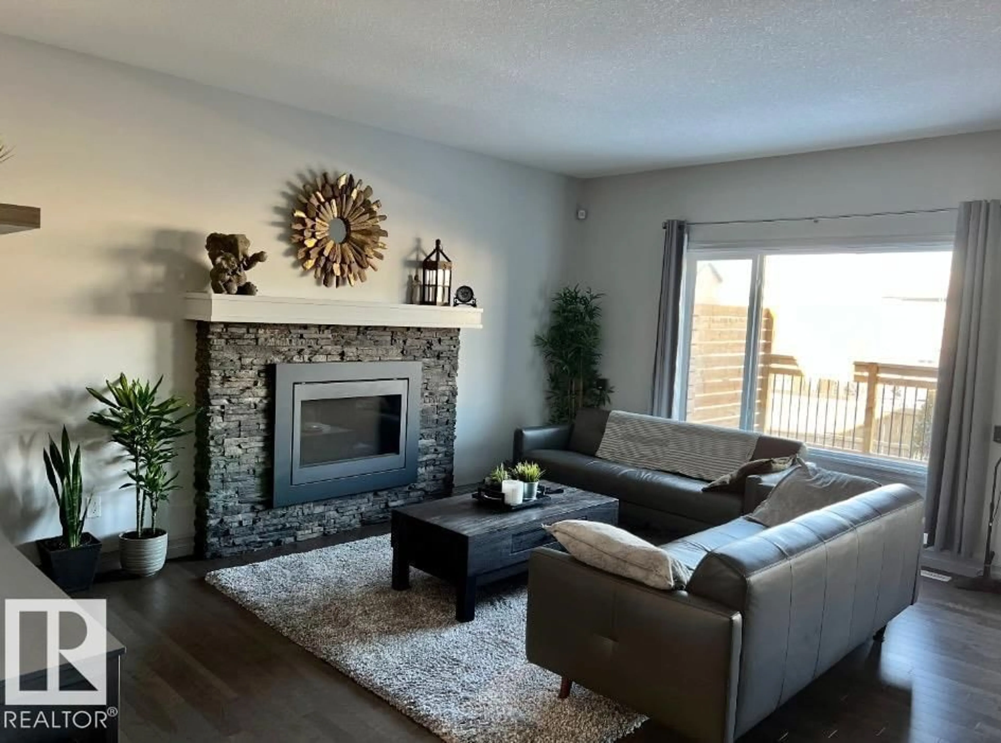 Living room with furniture, wood/laminate floor for 5912 19 AV, Edmonton Alberta T6X2A2