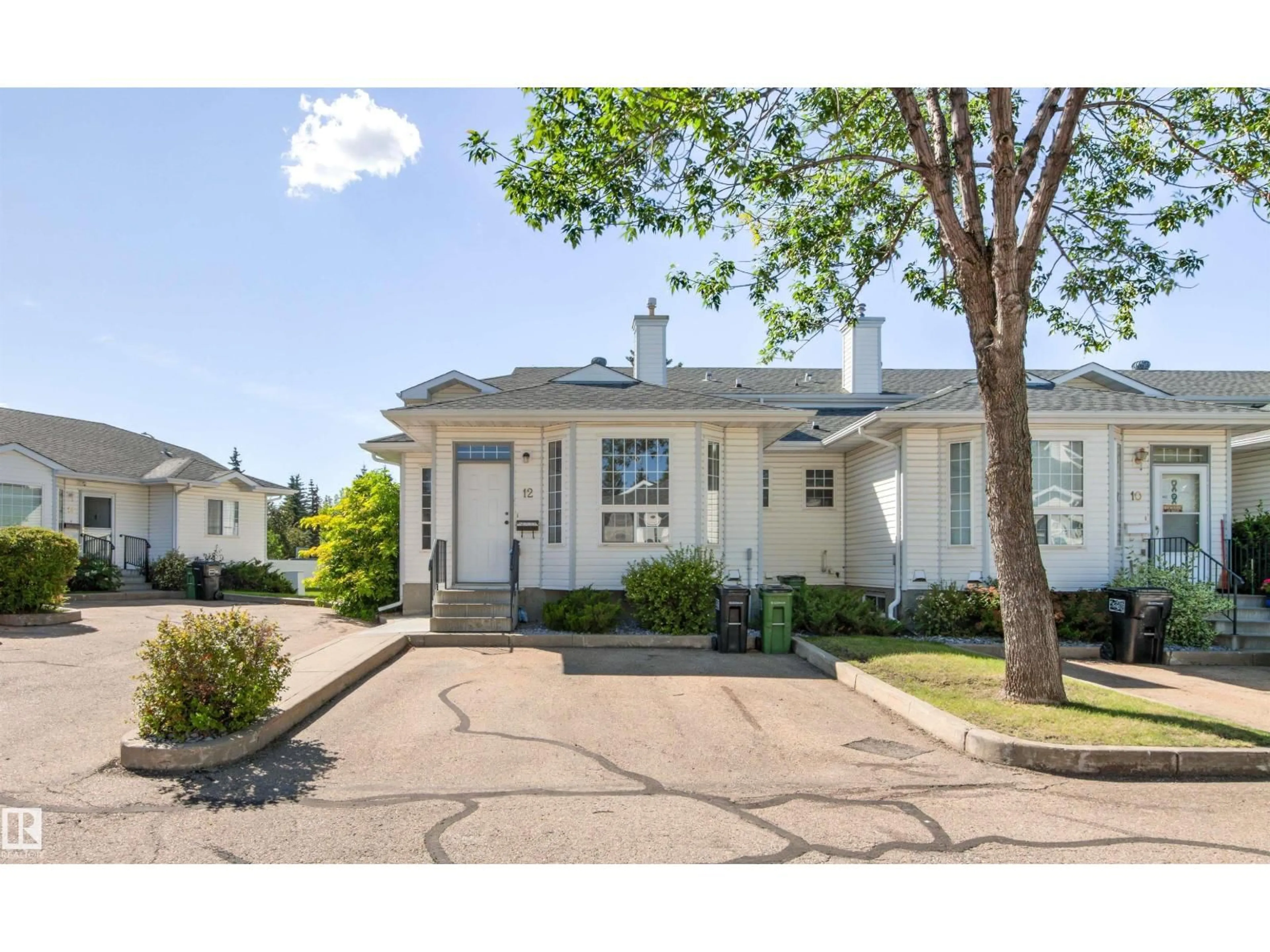 Home with vinyl exterior material, street for #12 - 3311 58 ST, Edmonton Alberta T6L6X3