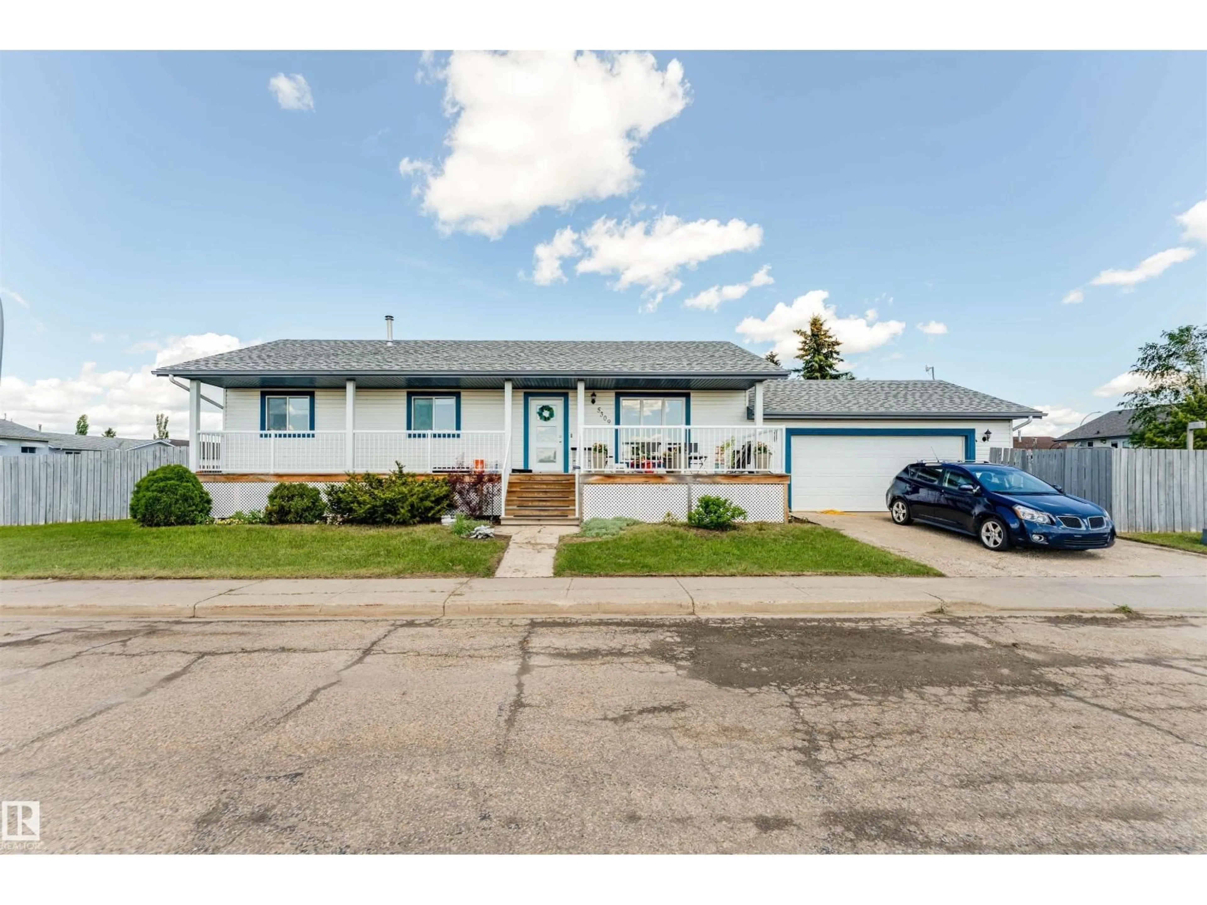 Home with vinyl exterior material, street for 5309 46 ST, Tofield Alberta T0B4J0
