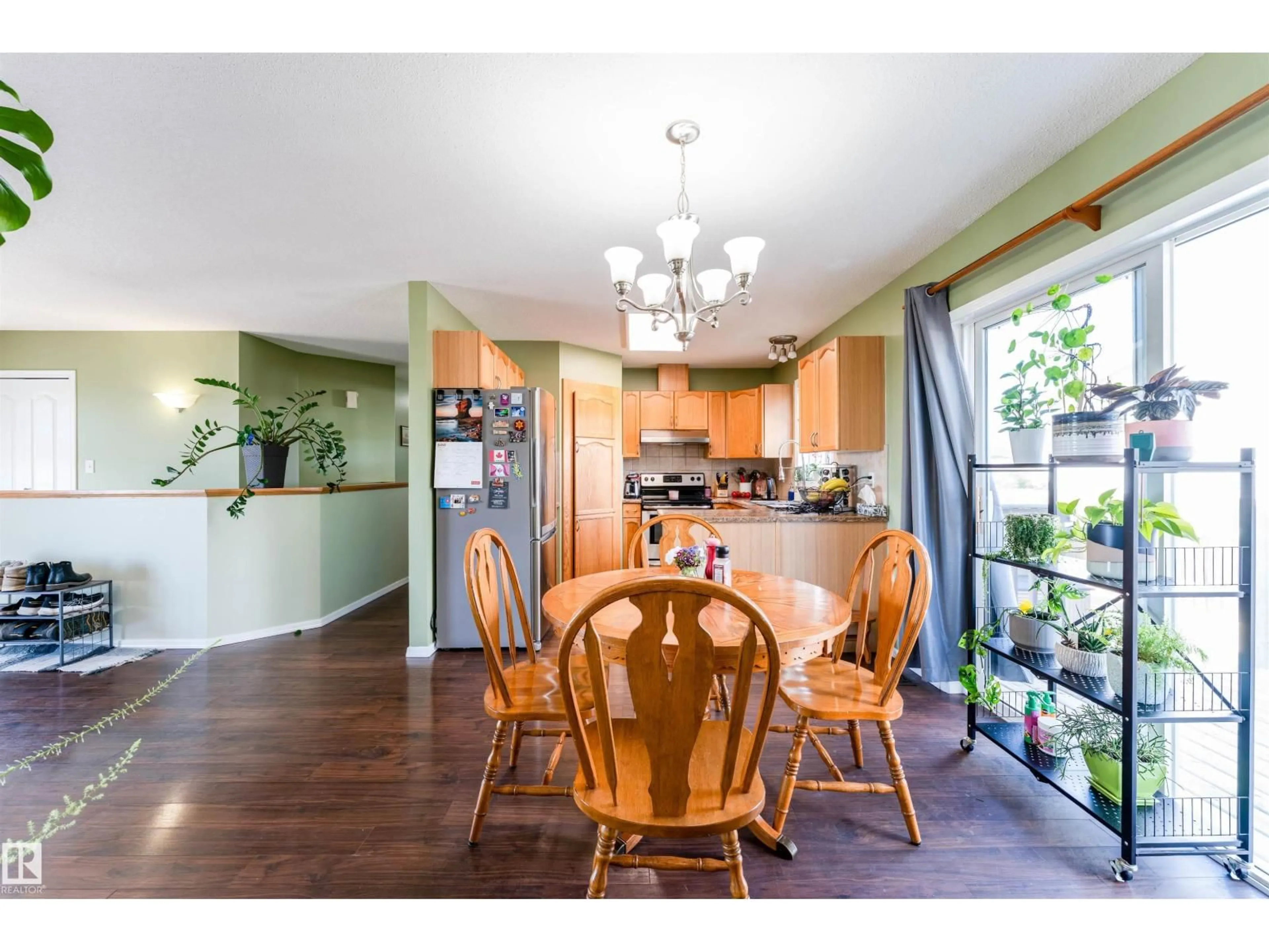 Open concept kitchen, wood/laminate floor for 5309 46 ST, Tofield Alberta T0B4J0