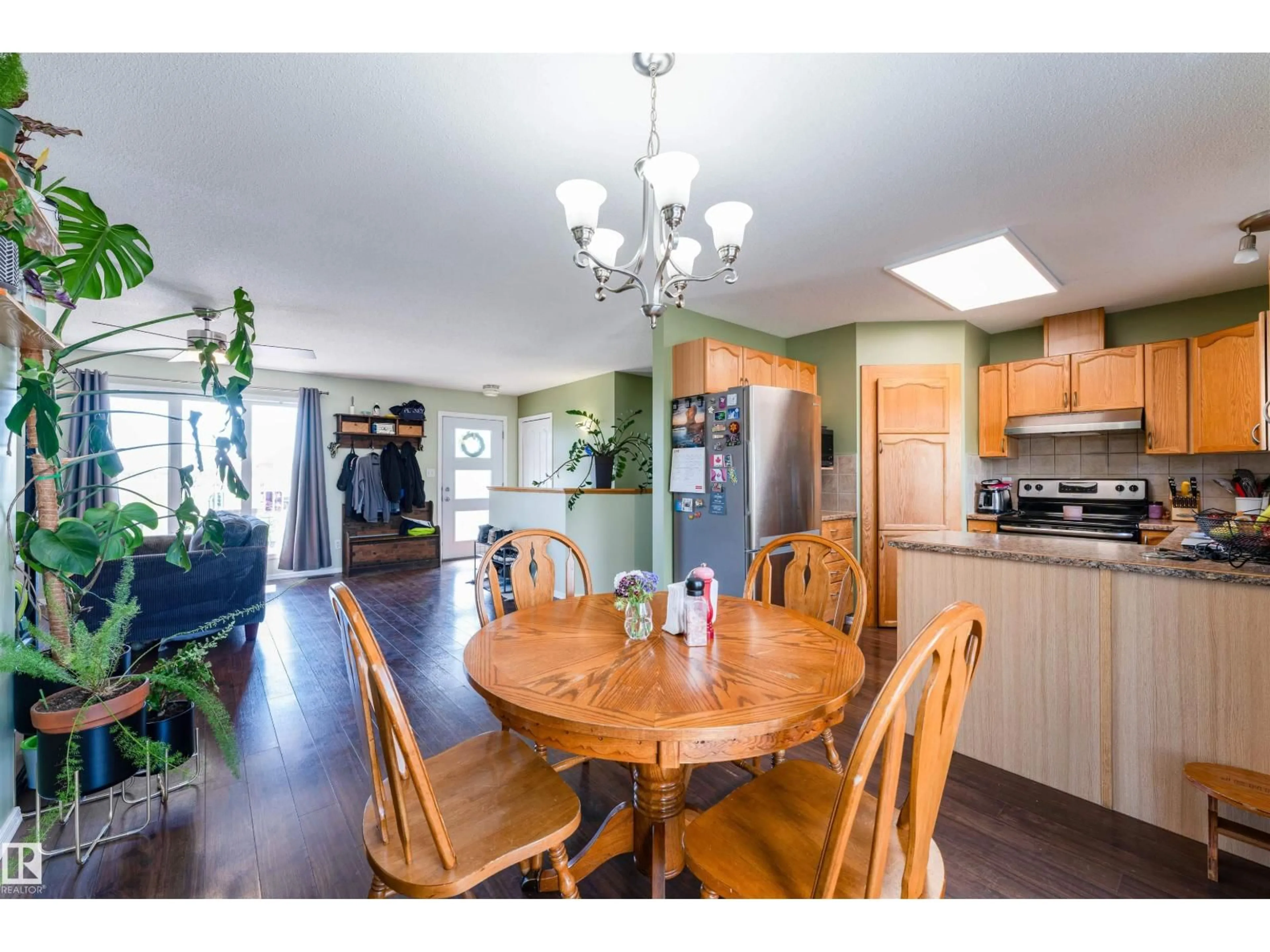 Open concept kitchen, wood/laminate floor for 5309 46 ST, Tofield Alberta T0B4J0