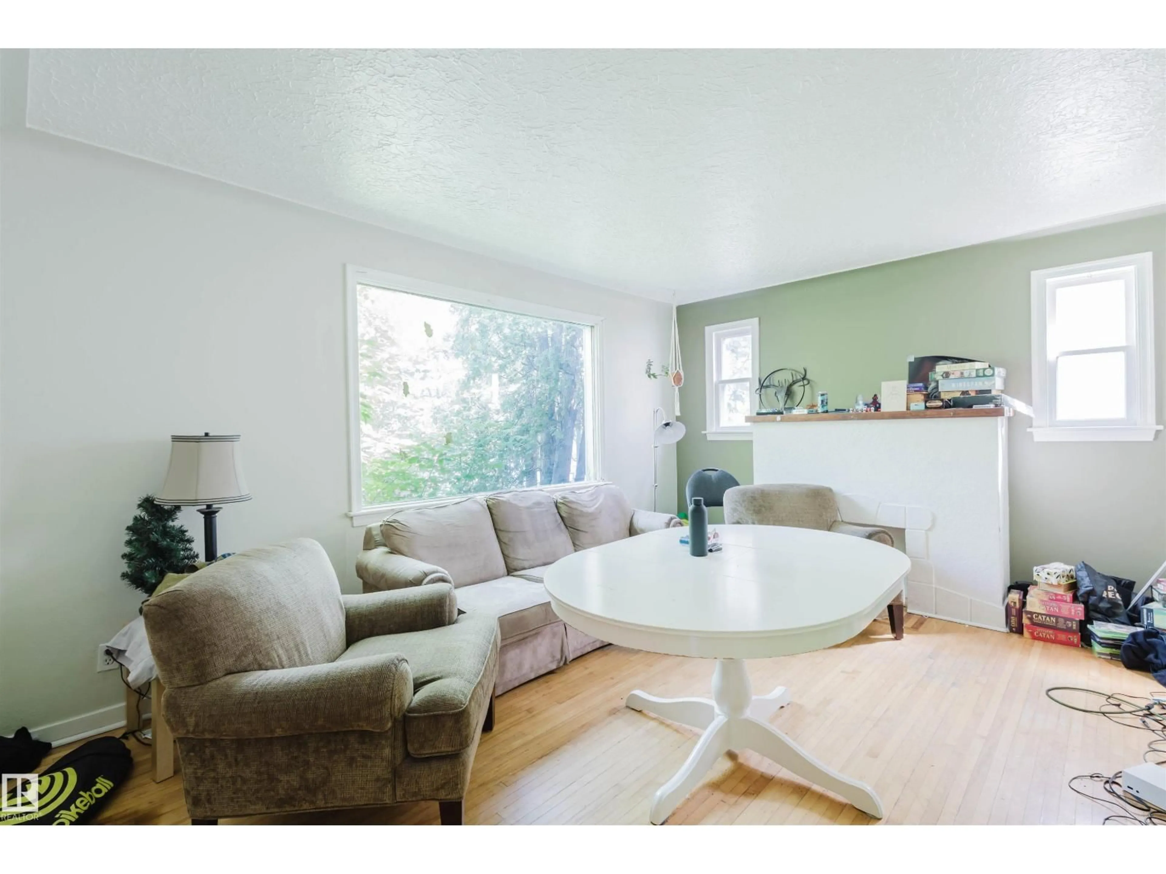 Living room with furniture, wood/laminate floor for 7230 112 ST, Edmonton Alberta T6G1J3