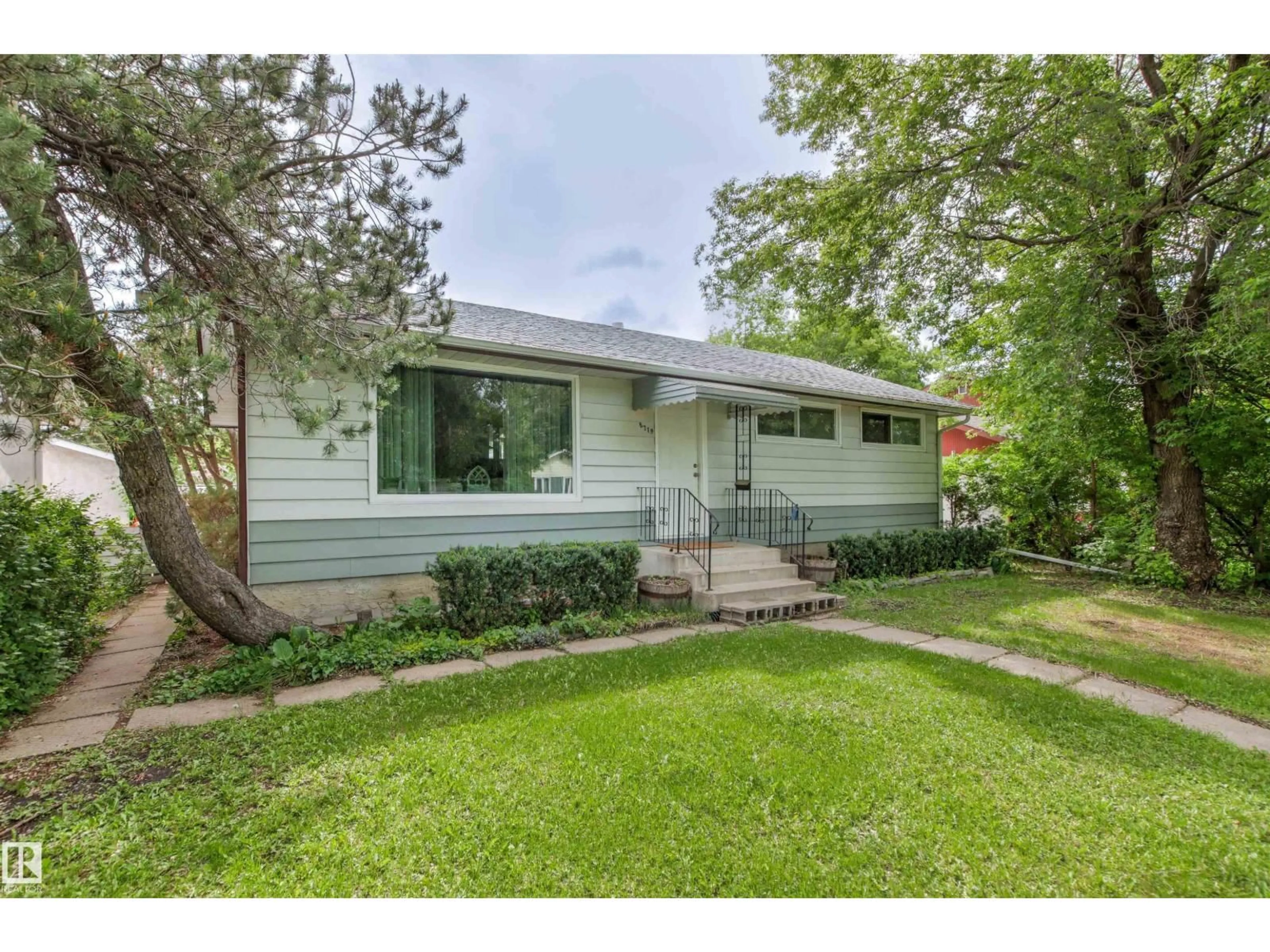 Home with vinyl exterior material, street for NW - 8719 164A ST, Edmonton Alberta T5R2R2
