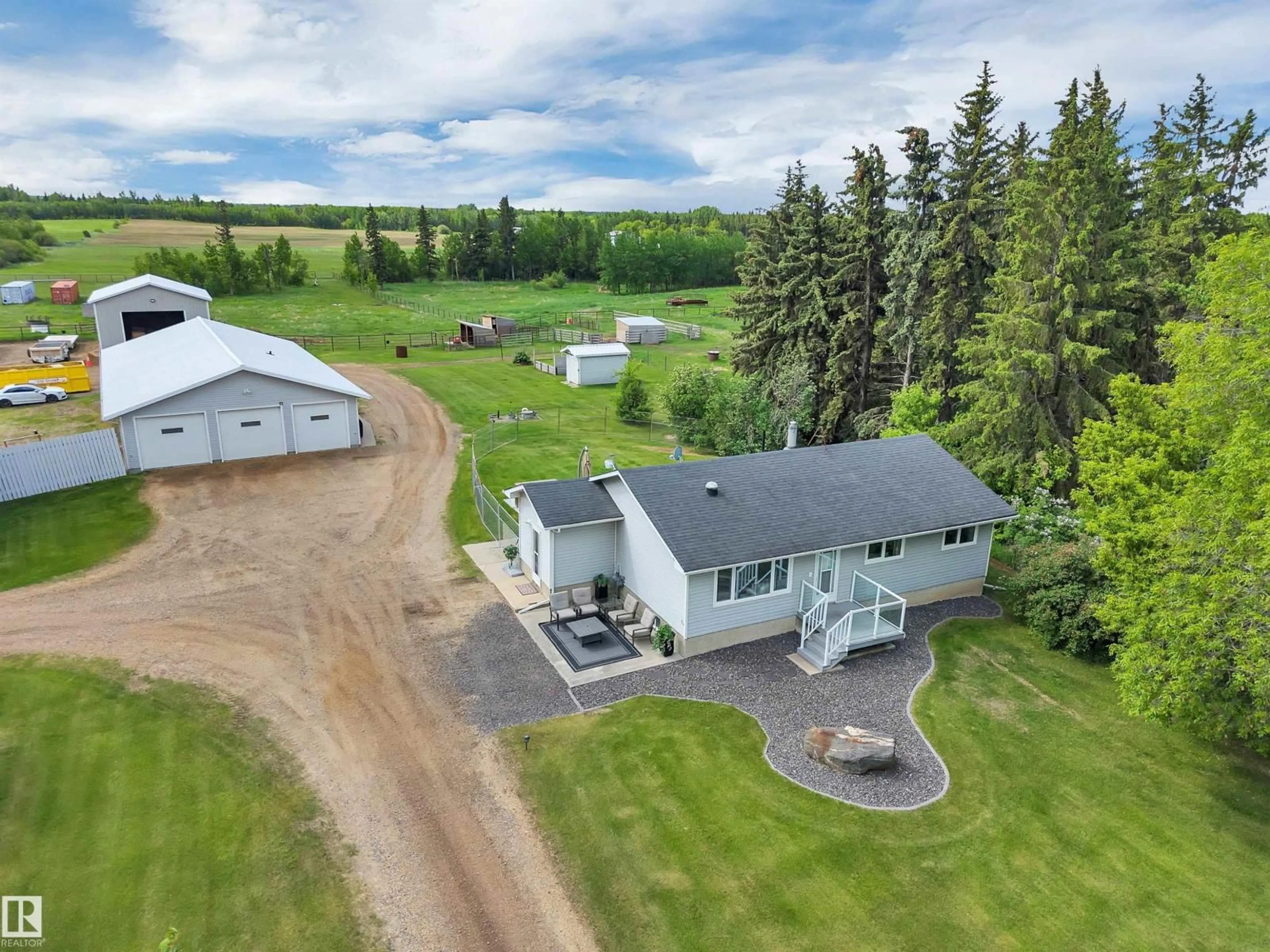 A pic from outside/outdoor area/front of a property/back of a property/a pic from drone, building for 22363 WYE RD, Rural Strathcona County Alberta T8C1H7