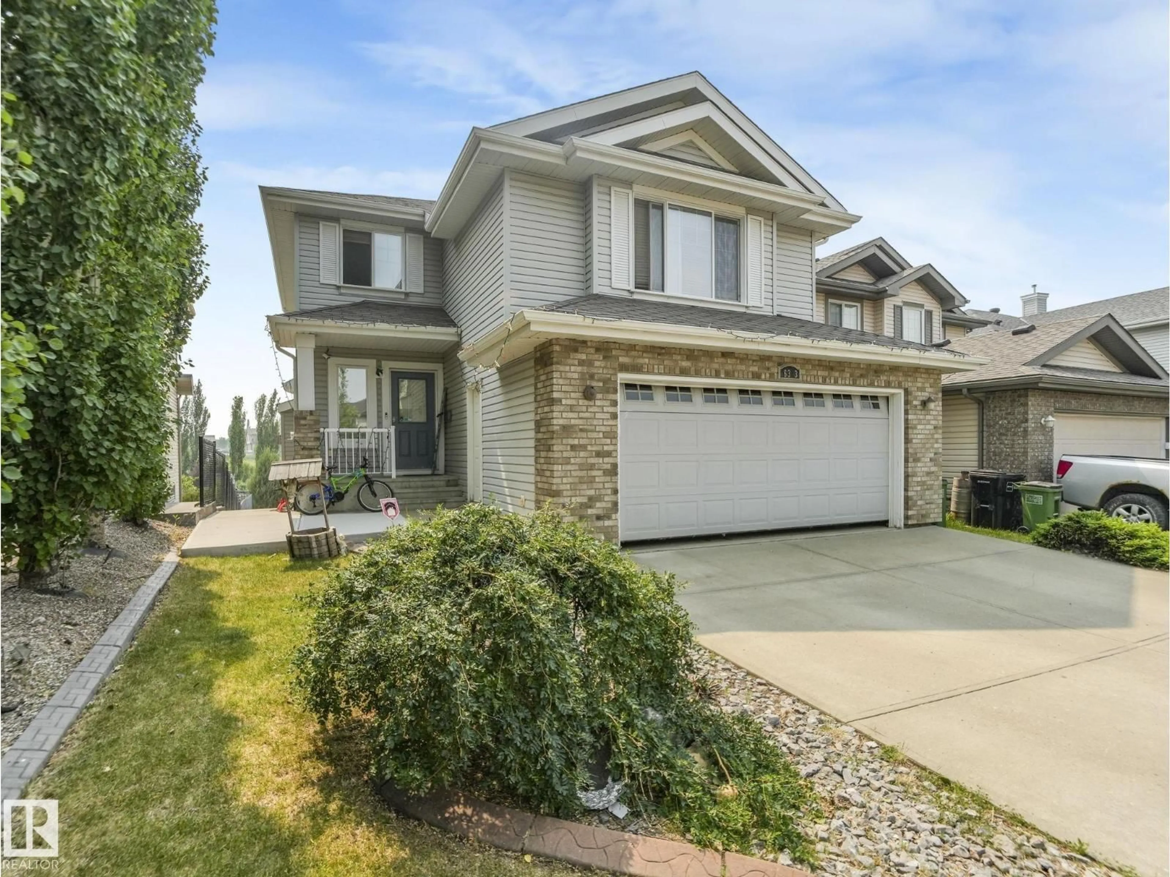 Home with vinyl exterior material, street for SW - 6303 4 AV, Edmonton Alberta T6X0C2