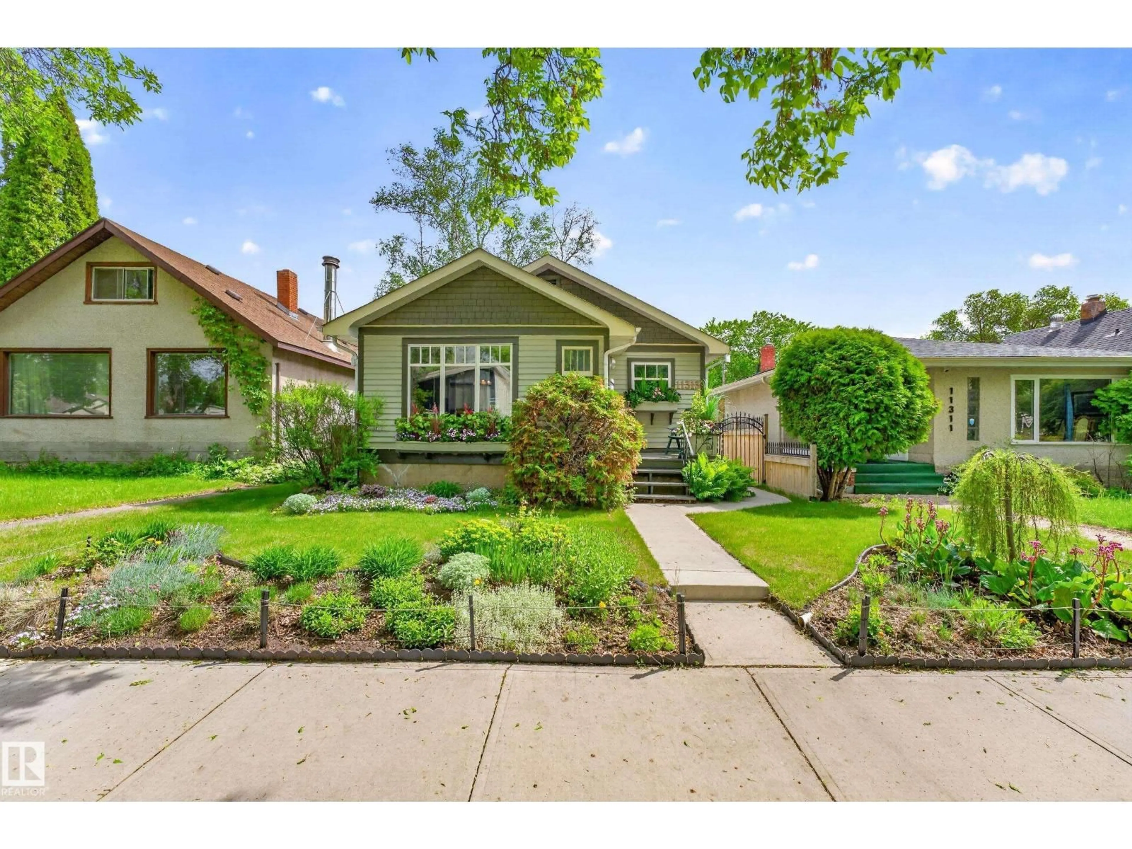 Home with brick exterior material, street for 11313 67 ST, Edmonton Alberta T5B1L2