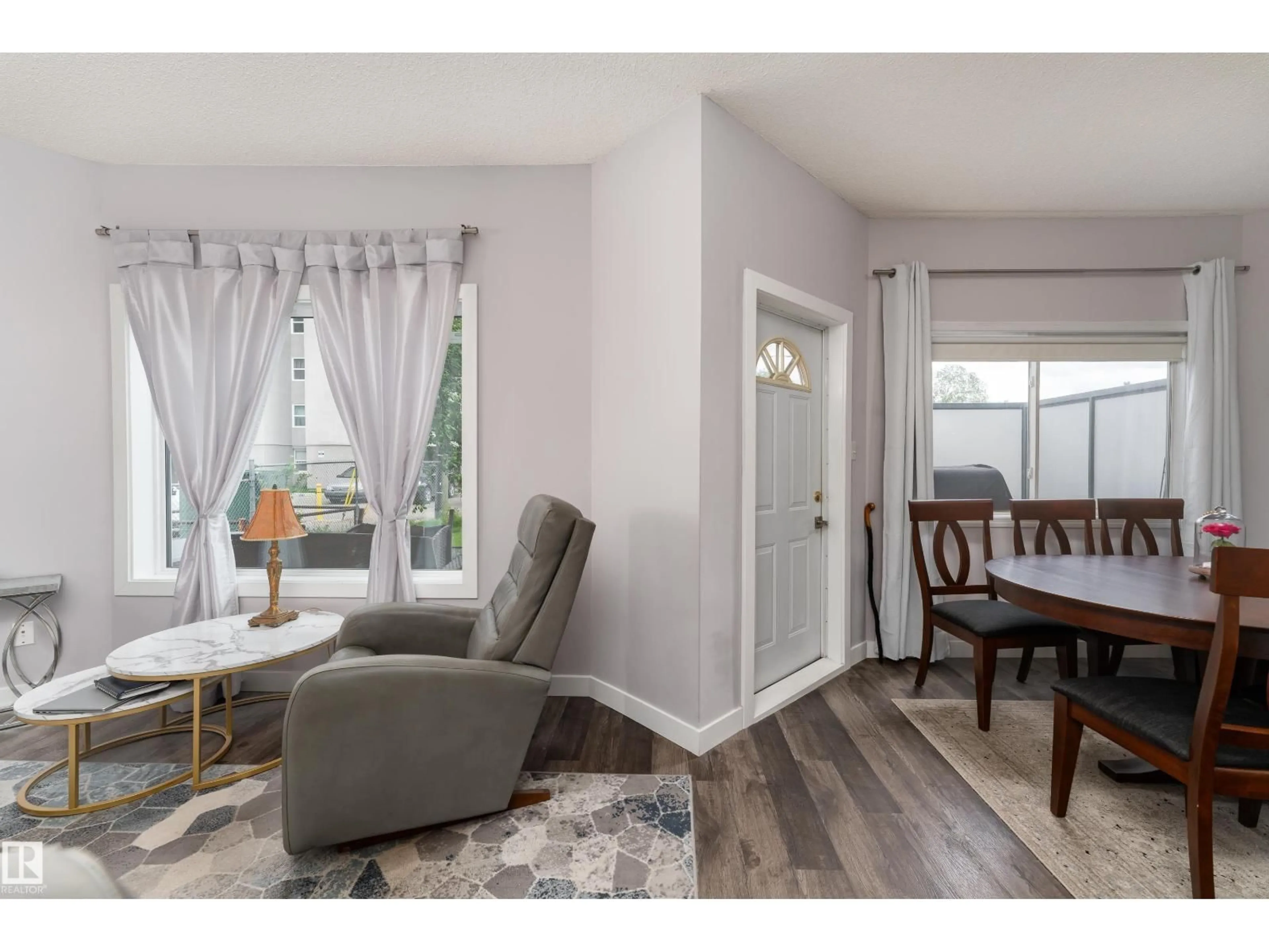 Living room with furniture, wood/laminate floor for #104 - 11308 130 AV, Edmonton Alberta T5E6L2