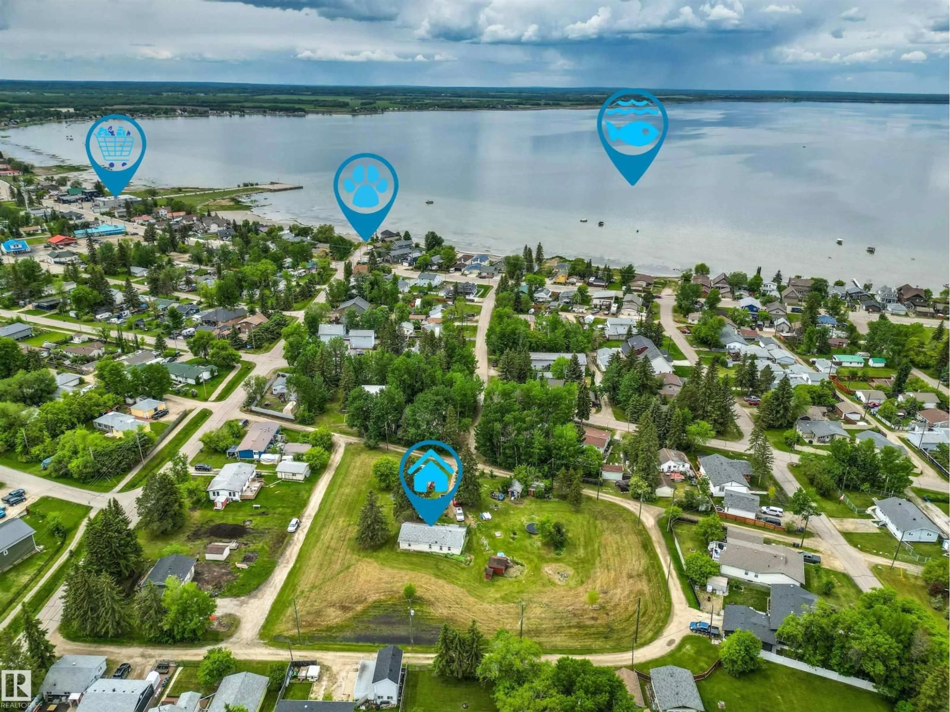 A pic from outside/outdoor area/front of a property/back of a property/a pic from drone, water/lake/river/ocean view for 4520 45 ST, Rural Lac Ste. Anne County Alberta T0E0E0