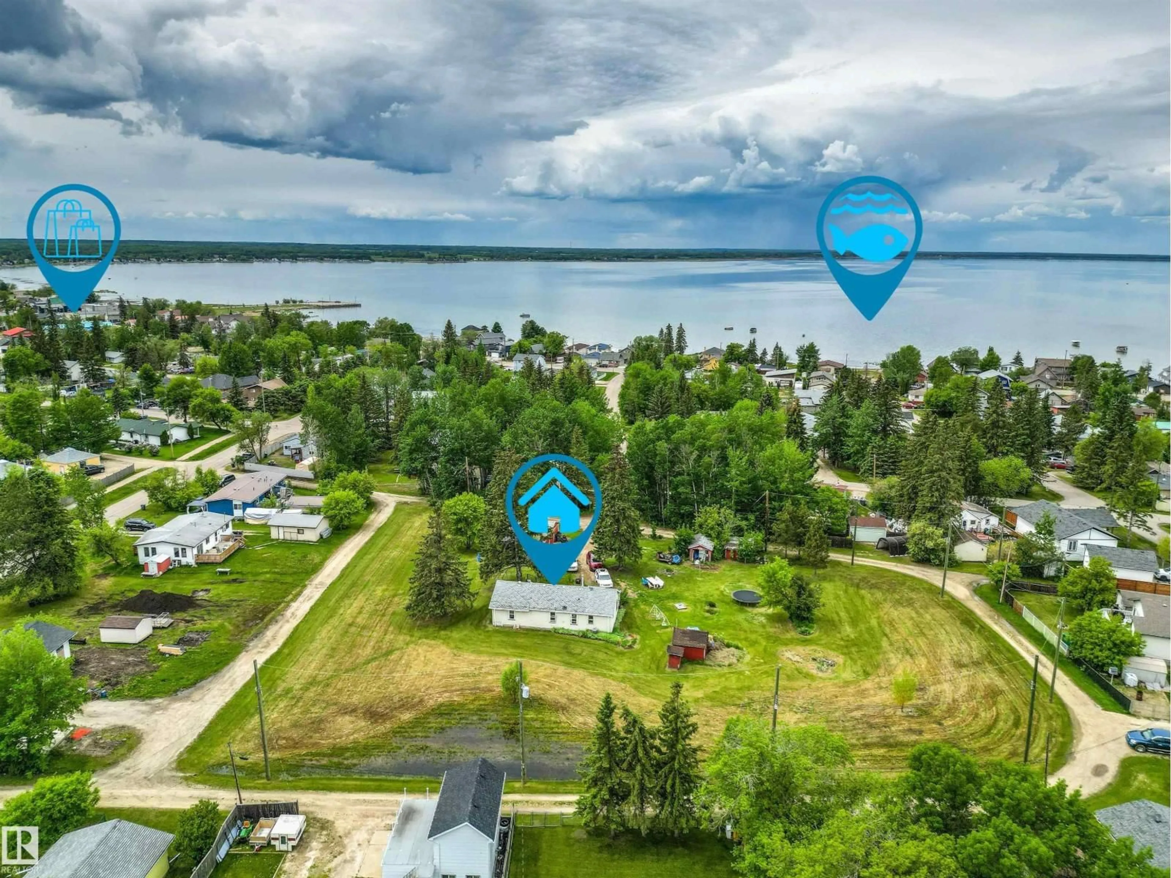 A pic from outside/outdoor area/front of a property/back of a property/a pic from drone, water/lake/river/ocean view for 4520 45 ST, Rural Lac Ste. Anne County Alberta T0E0E0