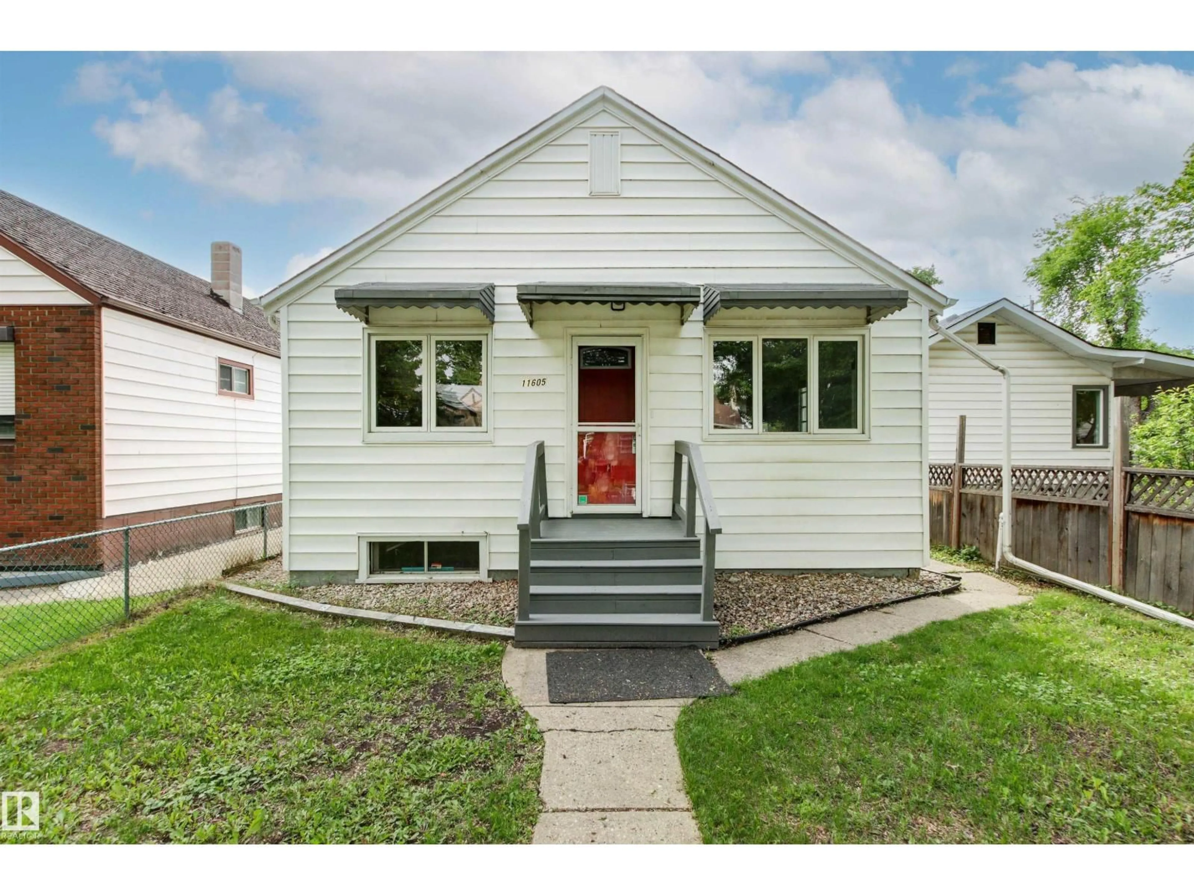 Home with vinyl exterior material, street for 11605 91 ST, Edmonton Alberta T5B4A9