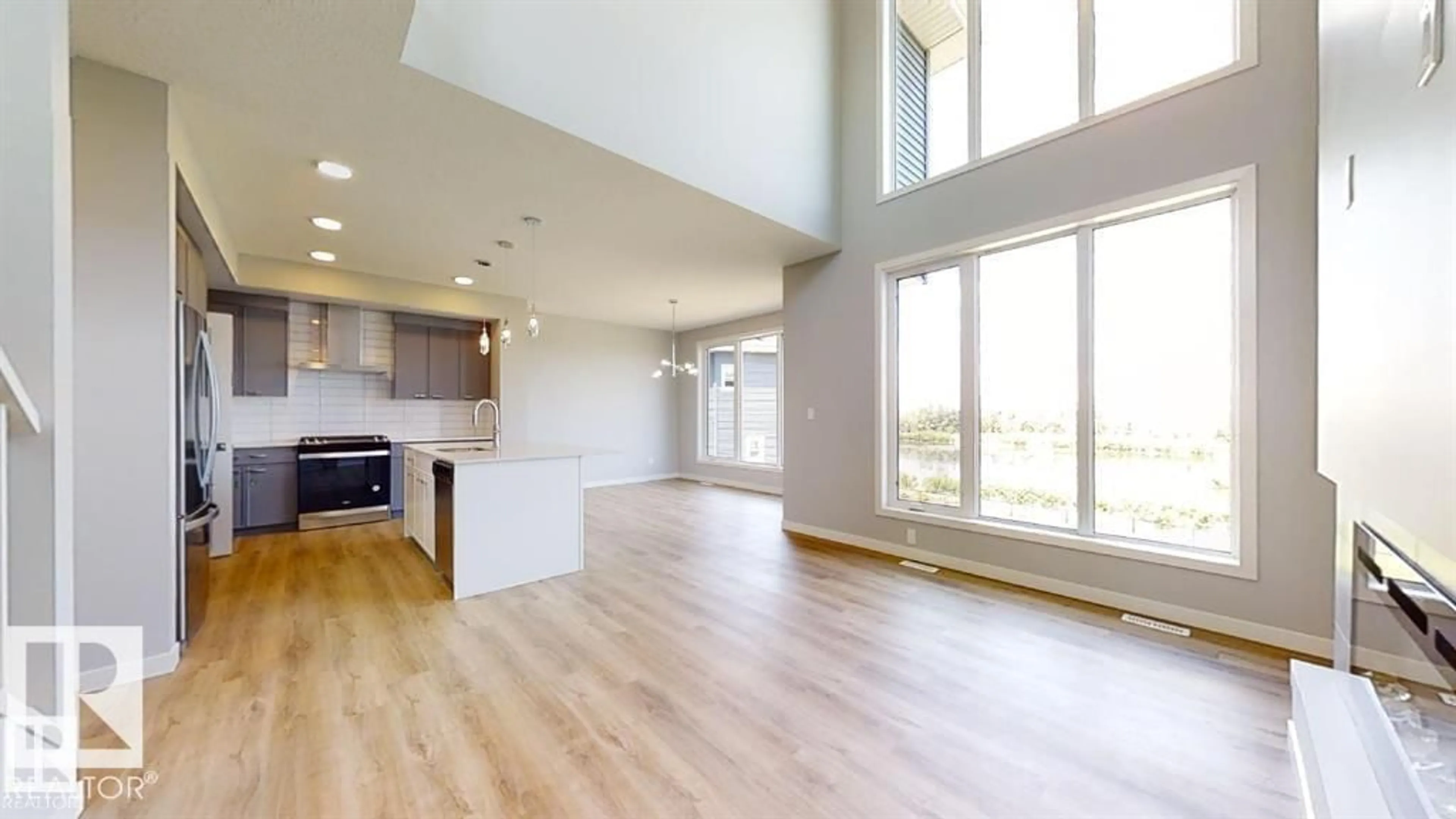 Open concept kitchen, wood/laminate floor for SW - 3918 3A AV, Edmonton Alberta T6X3A3