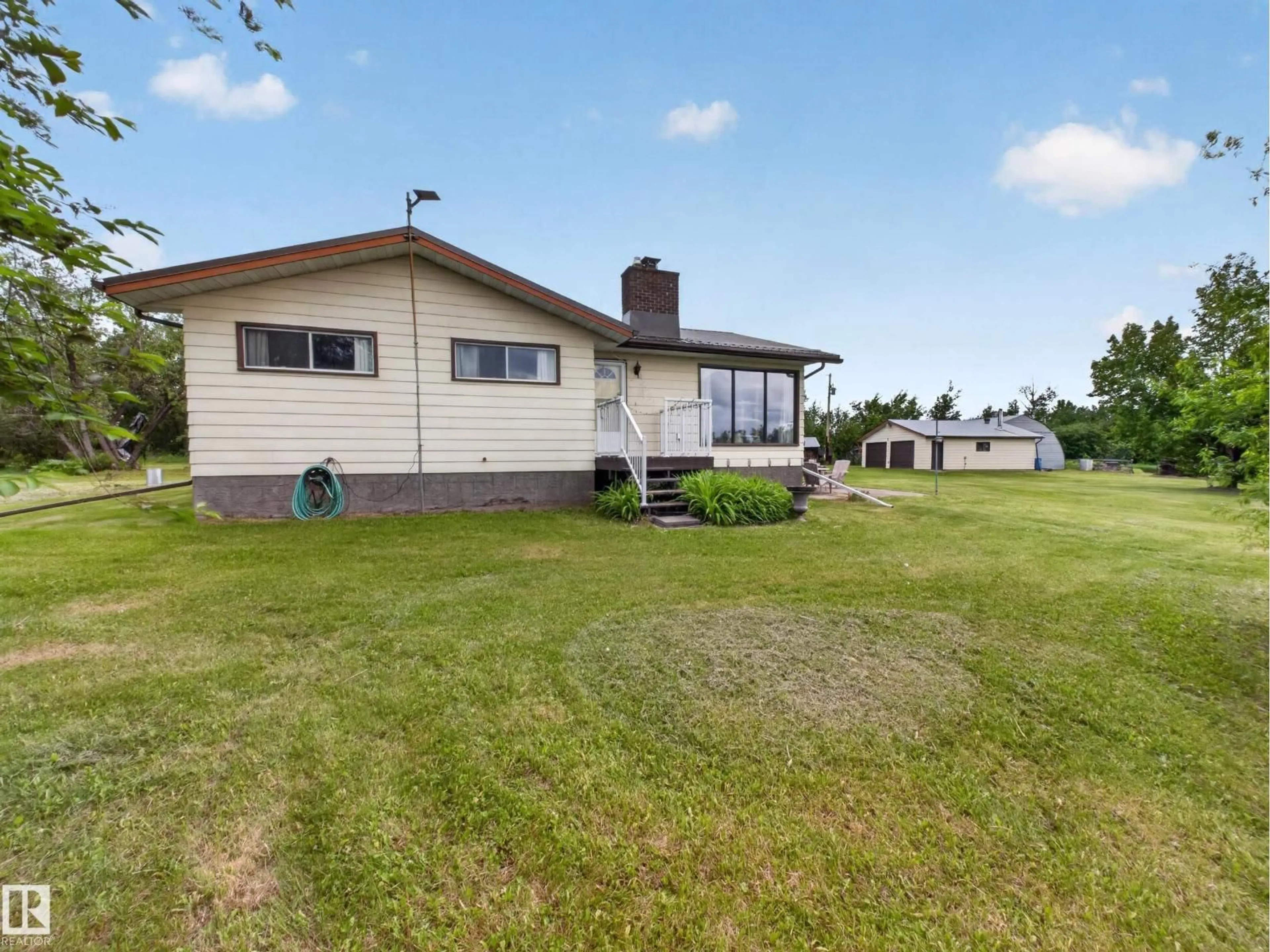 A pic from outside/outdoor area/front of a property/back of a property/a pic from drone, unknown for 1415 HWY 37, Rural Lac Ste. Anne County Alberta T0E1V0