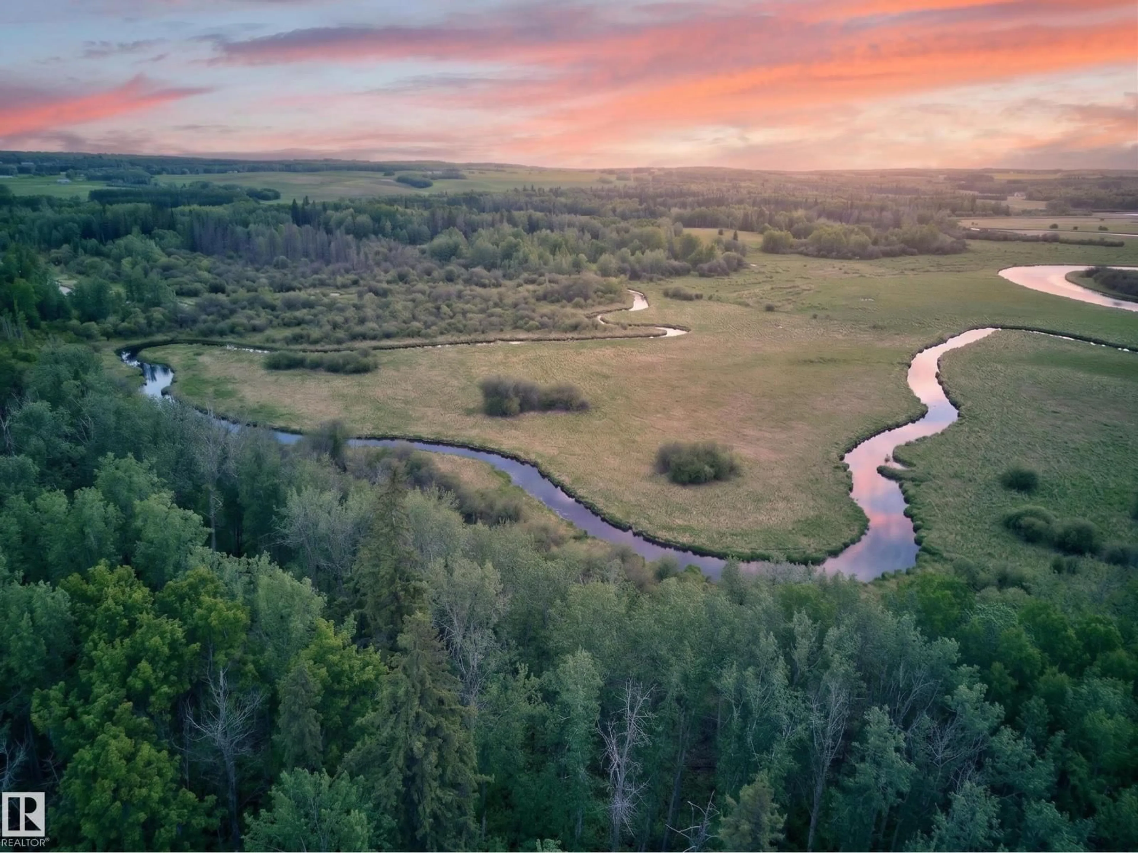 A pic from outside/outdoor area/front of a property/back of a property/a pic from drone, water/lake/river/ocean view for 1415 HWY 37, Rural Lac Ste. Anne County Alberta T0E1V0