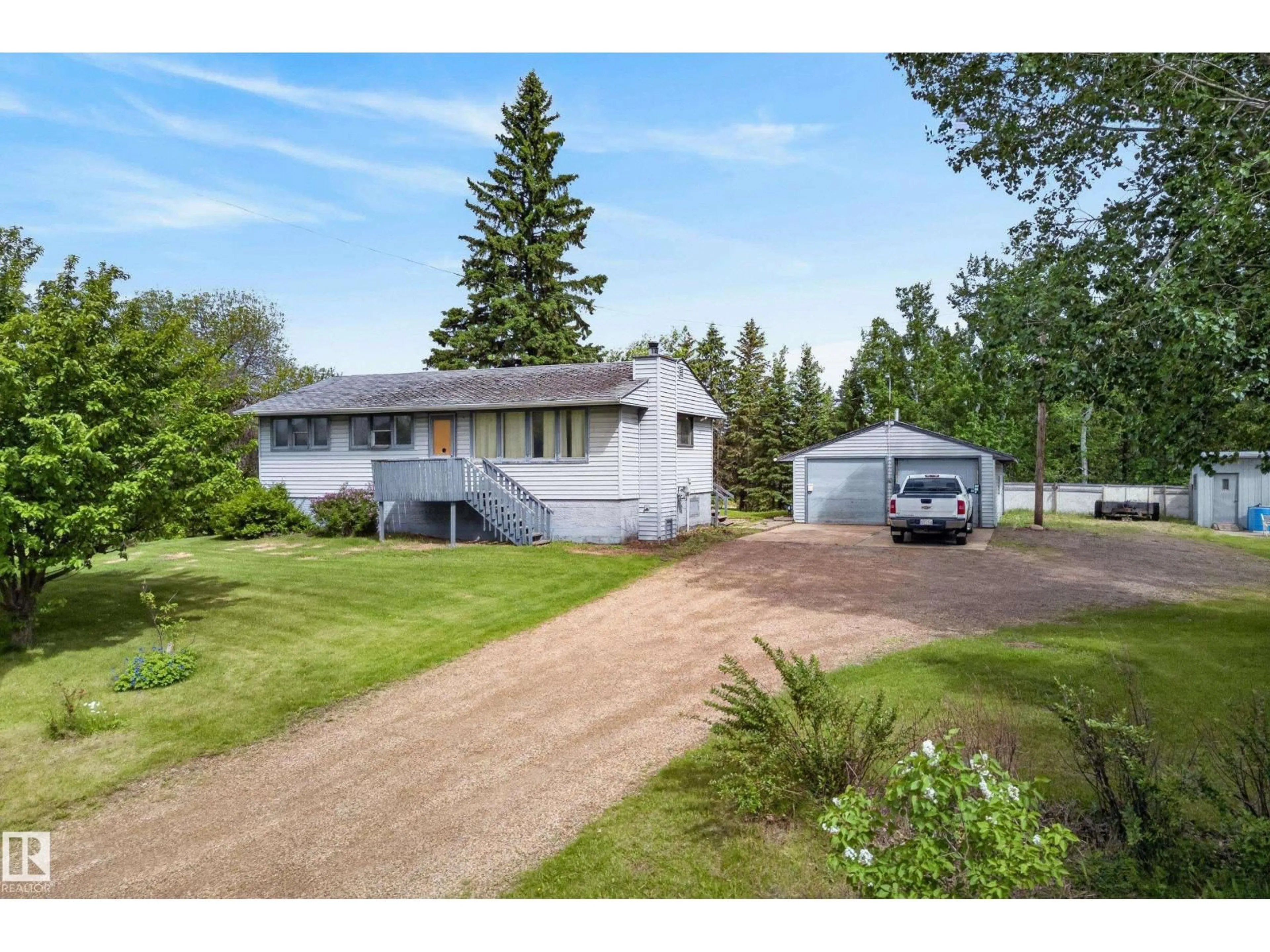 A pic from outside/outdoor area/front of a property/back of a property/a pic from drone, unknown for 22559 - 499 WYE RD, Rural Strathcona County Alberta T8B1J7