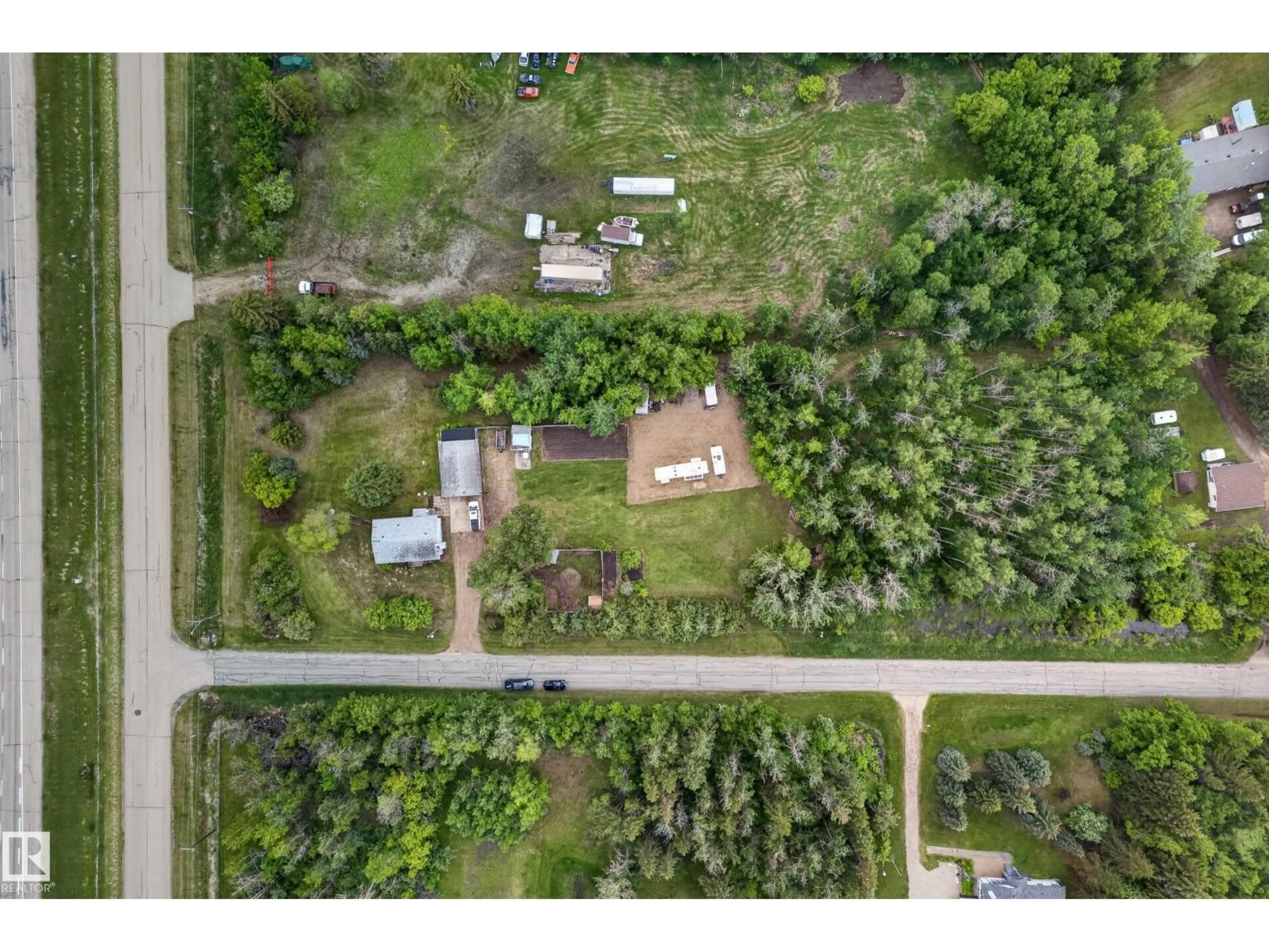 A pic from outside/outdoor area/front of a property/back of a property/a pic from drone, unknown for 22559 - 499 WYE RD, Rural Strathcona County Alberta T8B1J7