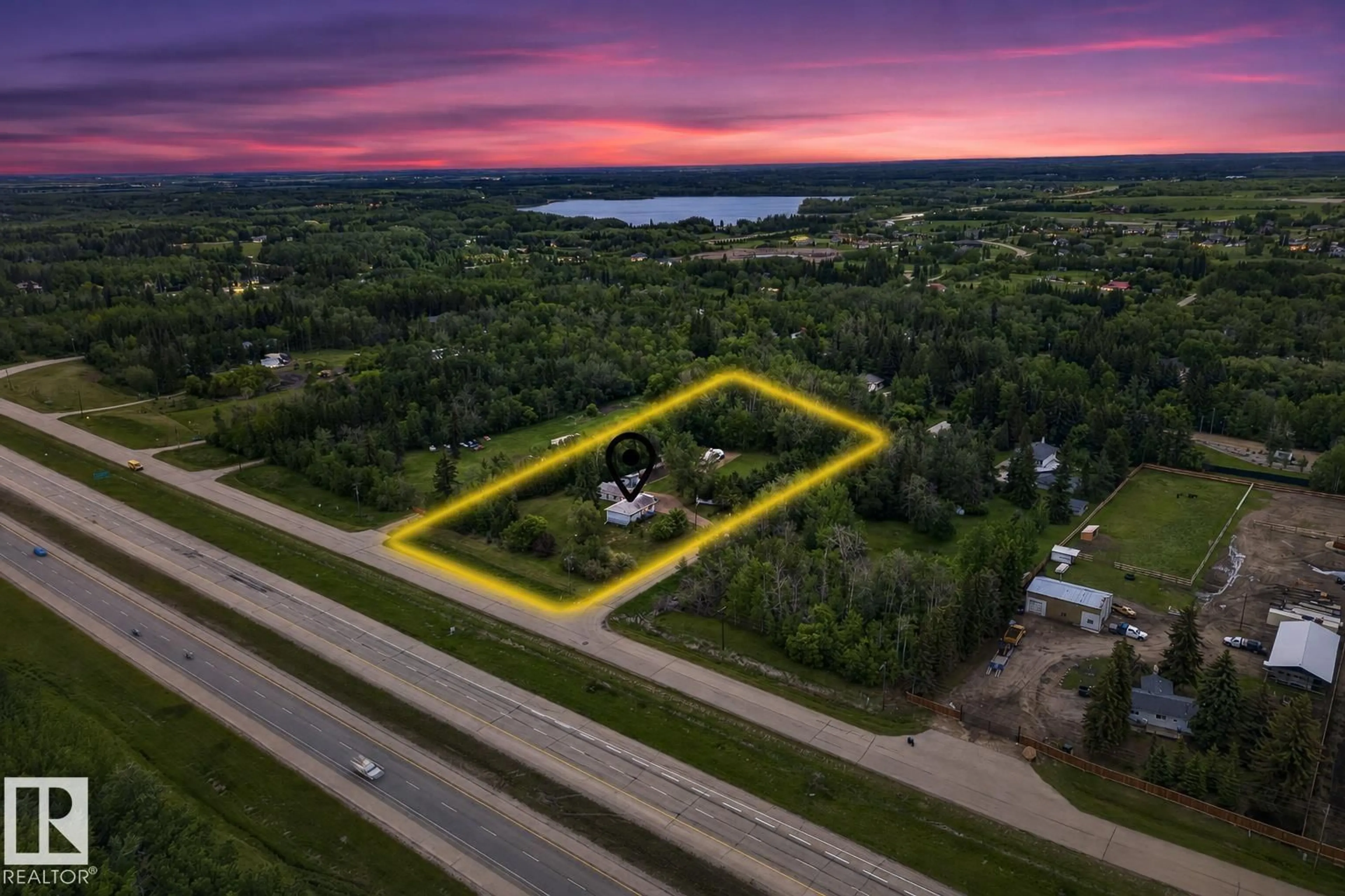 A pic from outside/outdoor area/front of a property/back of a property/a pic from drone, building for 22559 - 499 WYE RD, Rural Strathcona County Alberta T8B1J7
