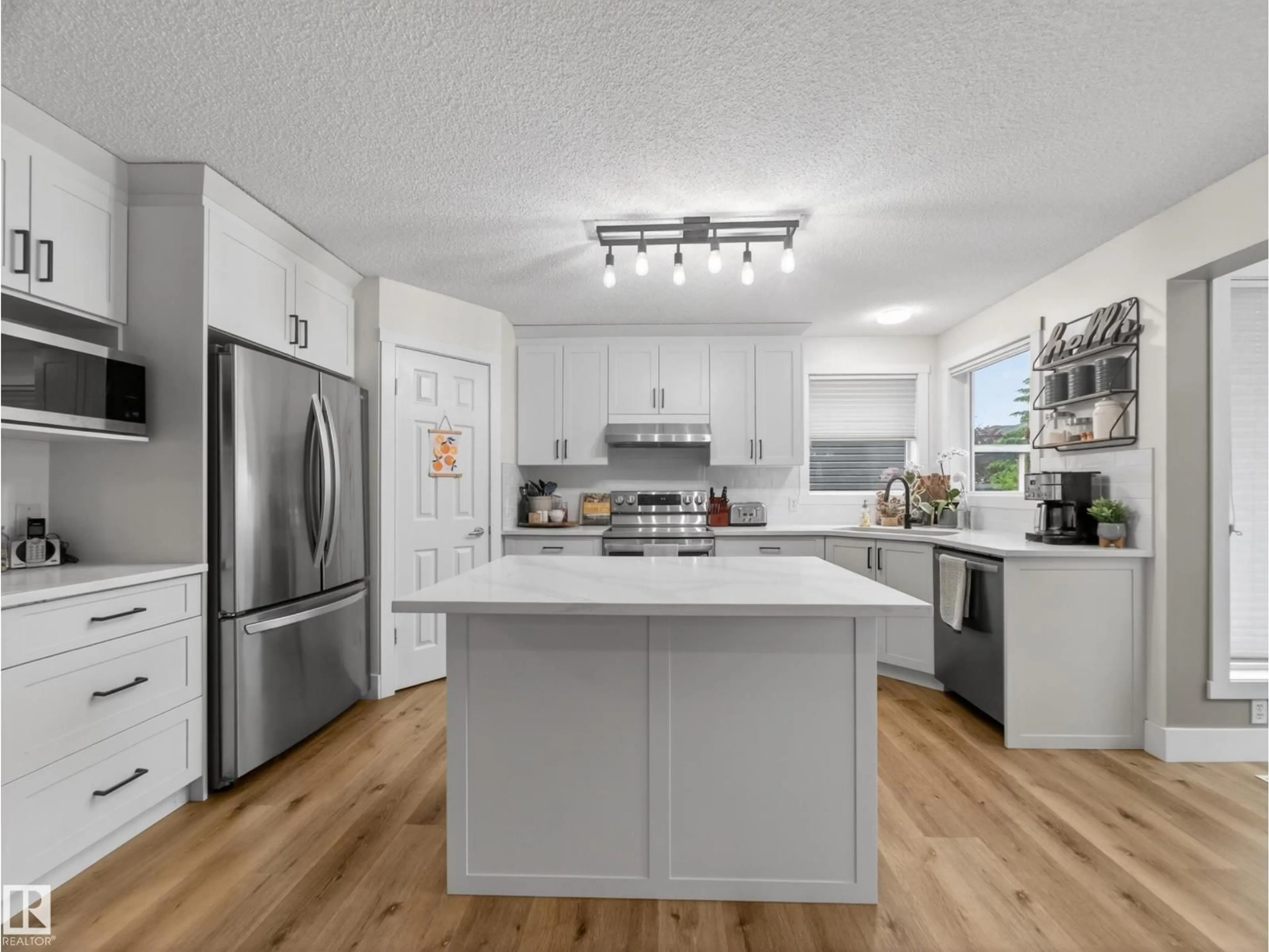Open concept kitchen, wood/laminate floor for 611 MEADOWVIEW CR, Sherwood Park Alberta T8H1X9