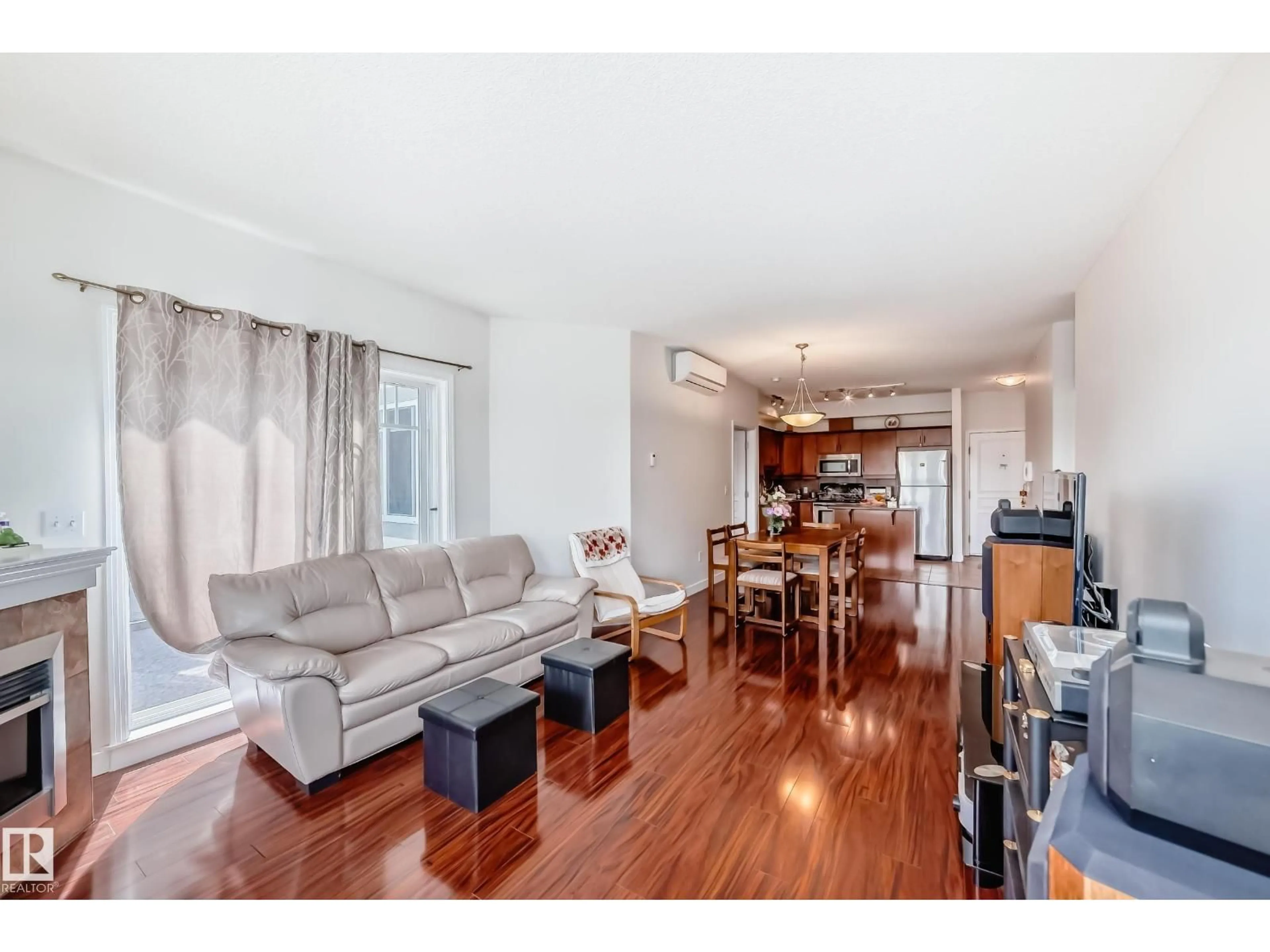 Living room with furniture, wood/laminate floor for 316 - 8931 156 ST, Edmonton Alberta T5R1Y6
