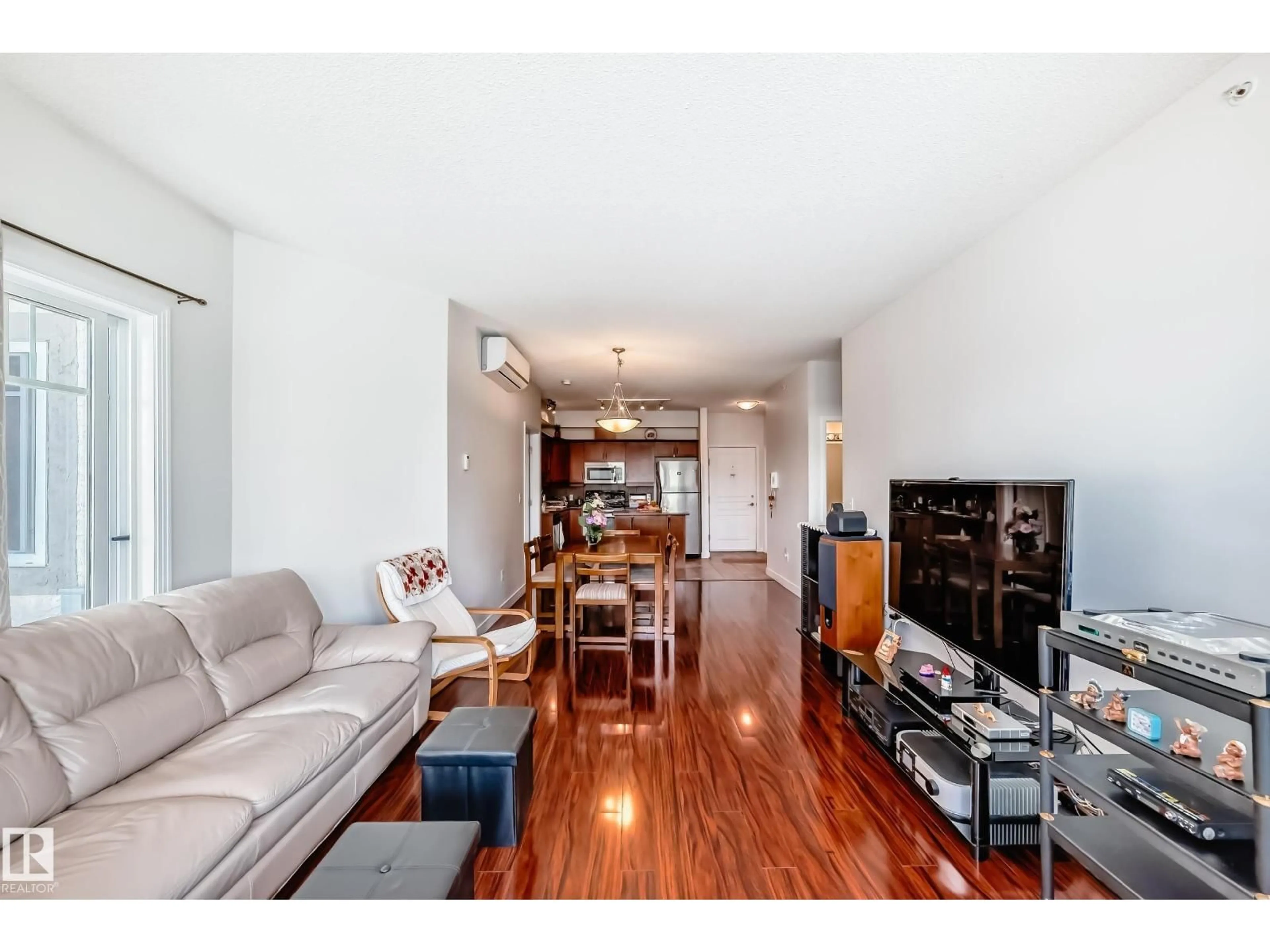 Living room with furniture, wood/laminate floor for 316 - 8931 156 ST, Edmonton Alberta T5R1Y6