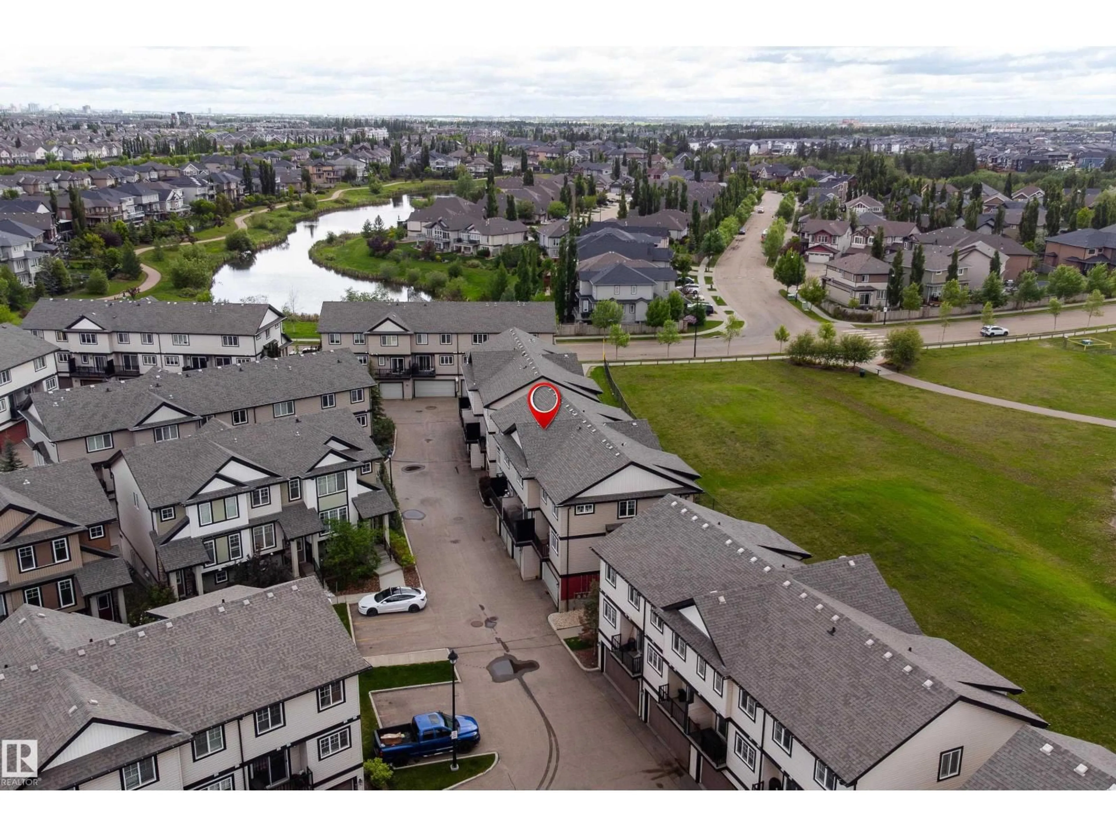 A pic from outside/outdoor area/front of a property/back of a property/a pic from drone, water/lake/river/ocean view for 1776 - 12 CUNNINGHAM WY, Edmonton Alberta T6W2J5