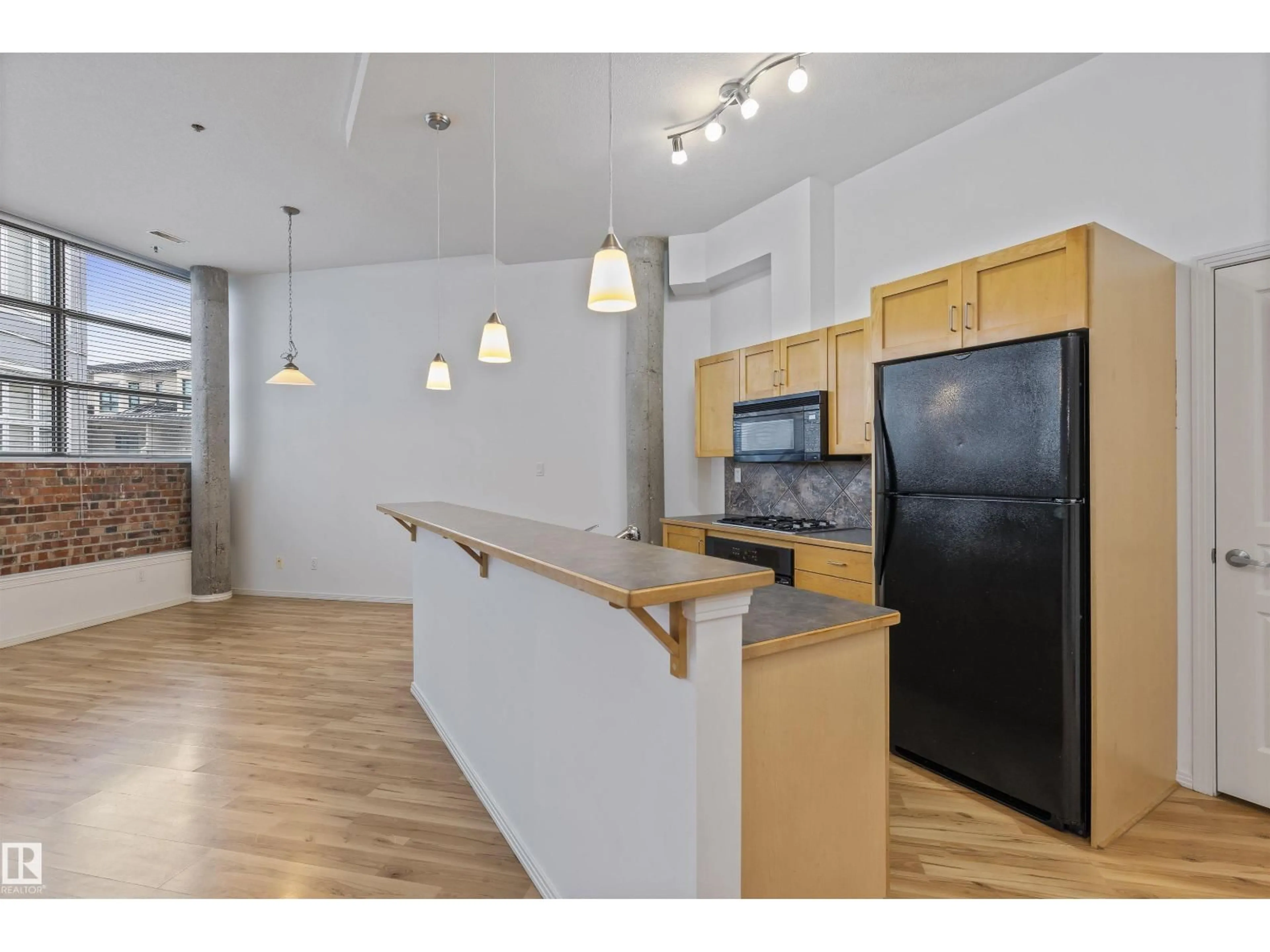 Open concept kitchen, wood/laminate floor for 202 - 10123 112 ST, Edmonton Alberta T5K1M1
