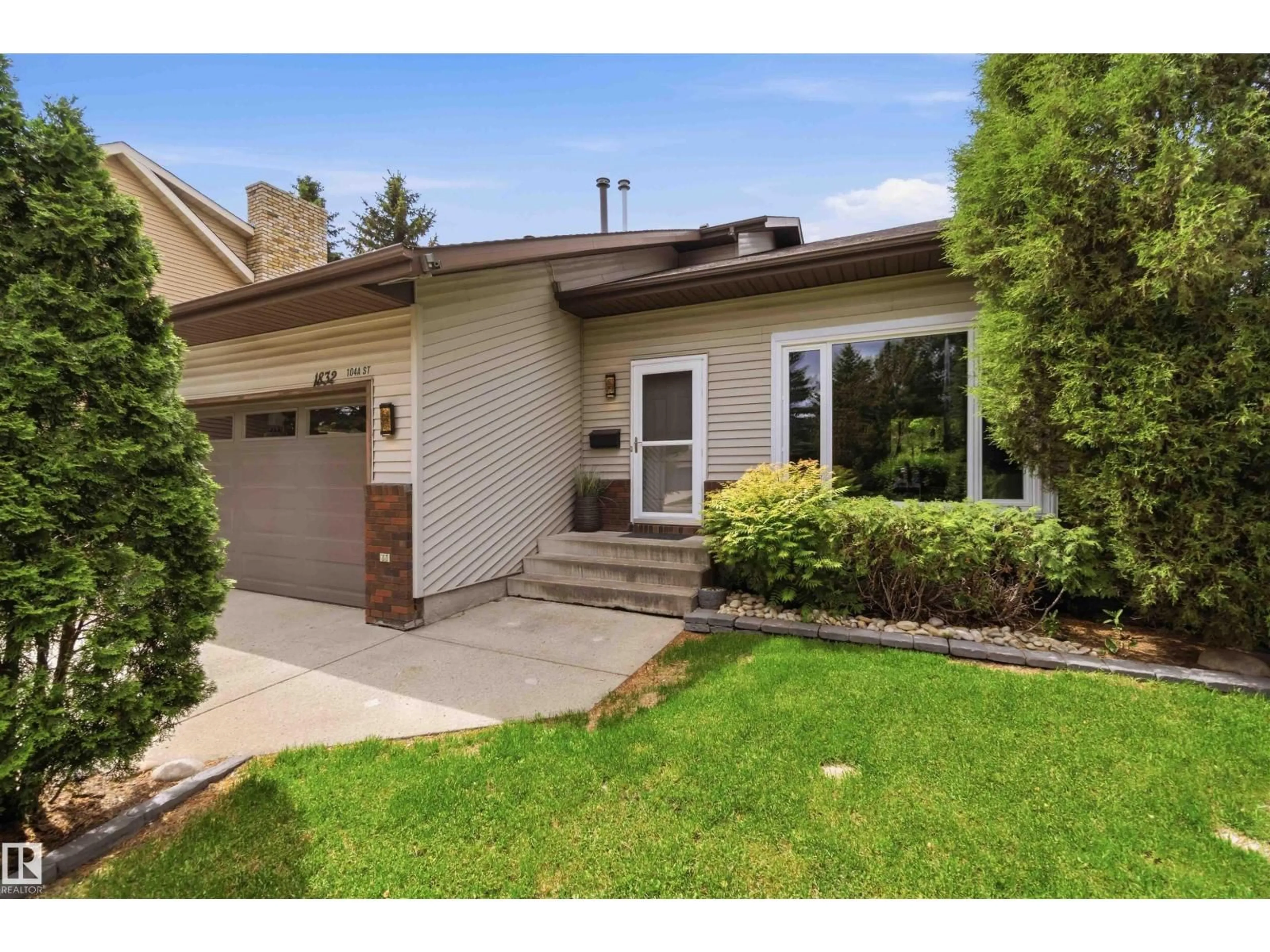 Home with brick exterior material, street for NW - 1832 104A ST, Edmonton Alberta T6J5A4