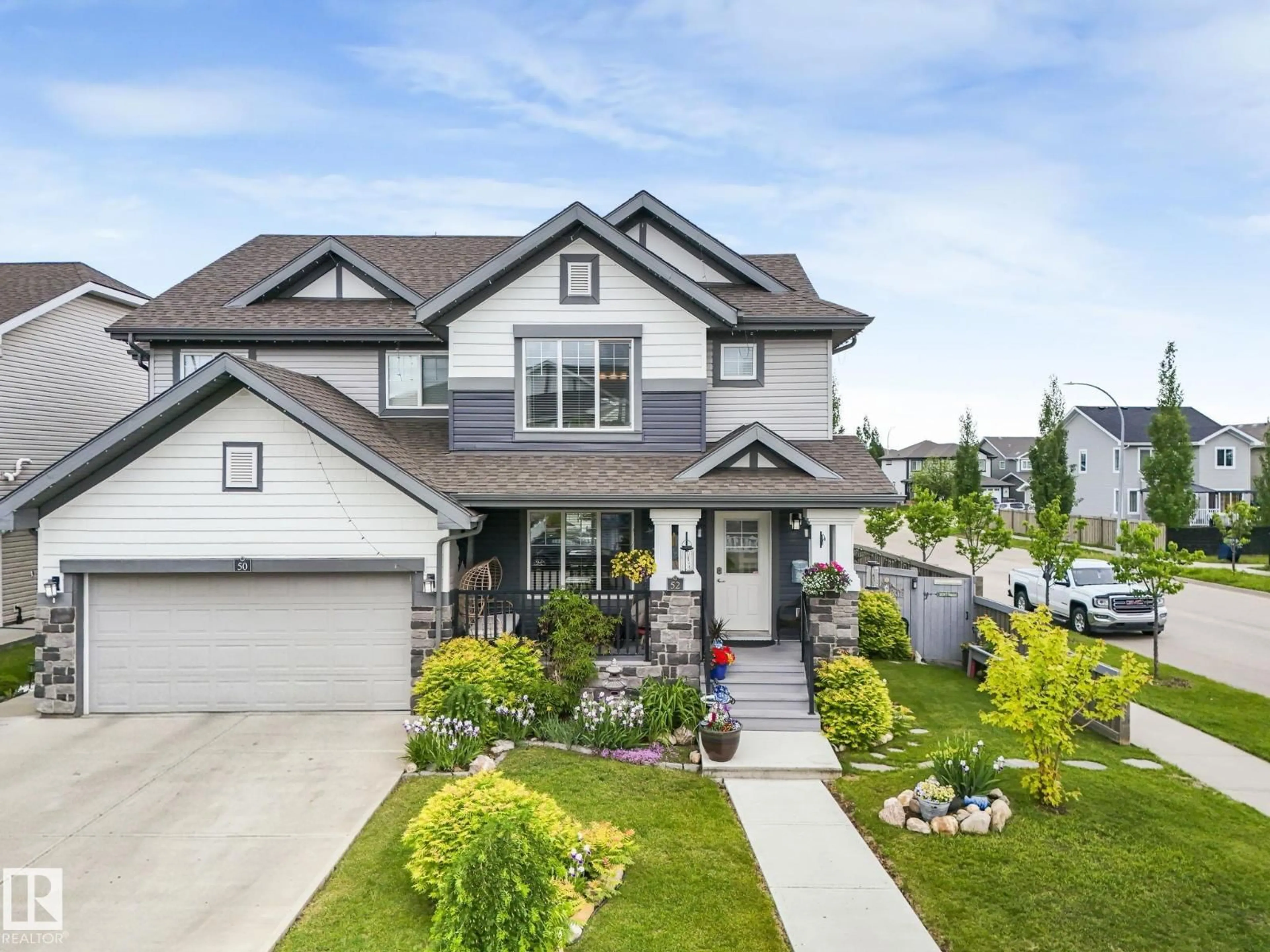 Home with vinyl exterior material, street for 52 SIERRA WD, Fort Saskatchewan Alberta T8L0T3