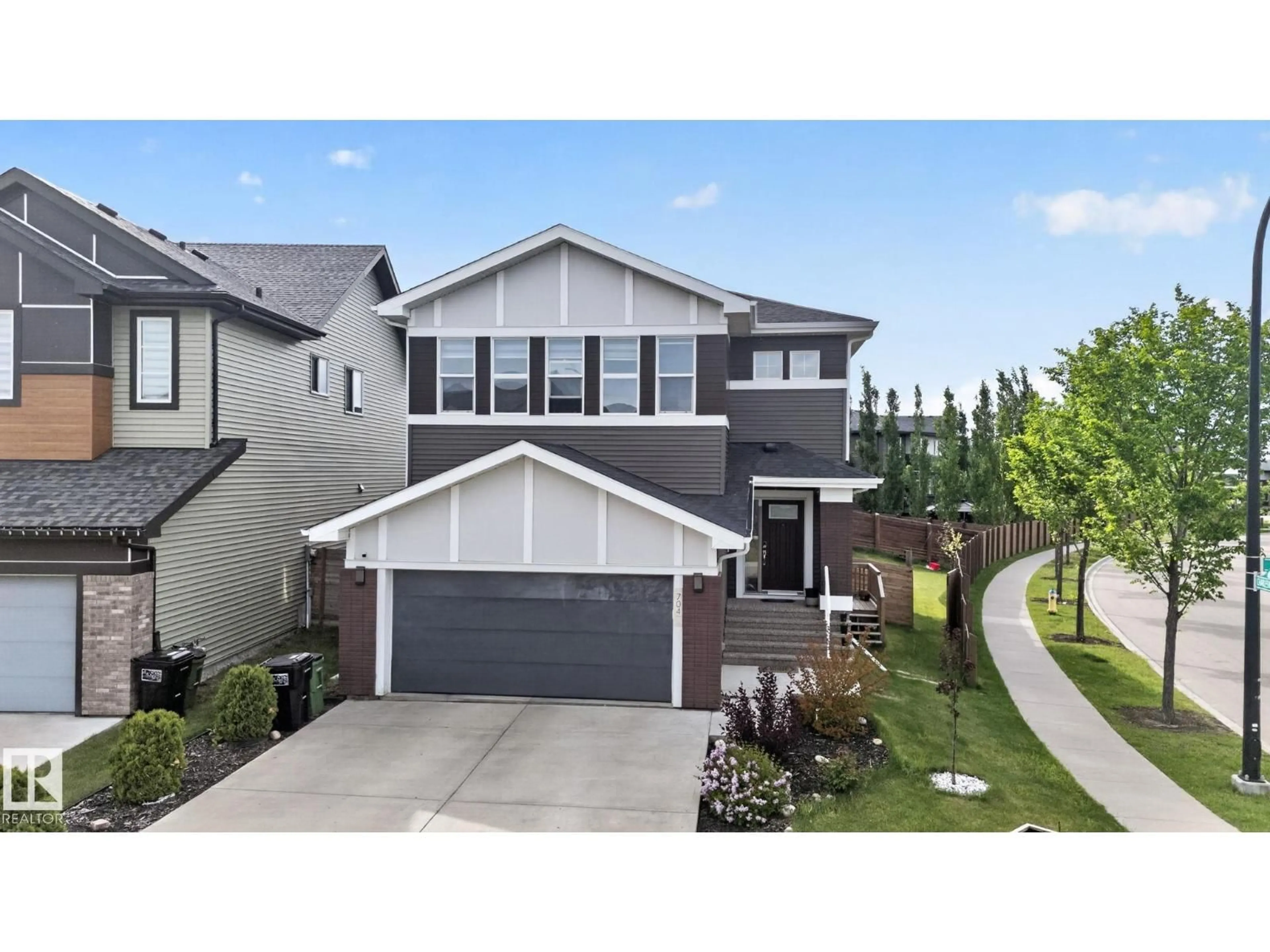 Home with vinyl exterior material, street for SW - 704 39 ST, Edmonton Alberta T6X2E9