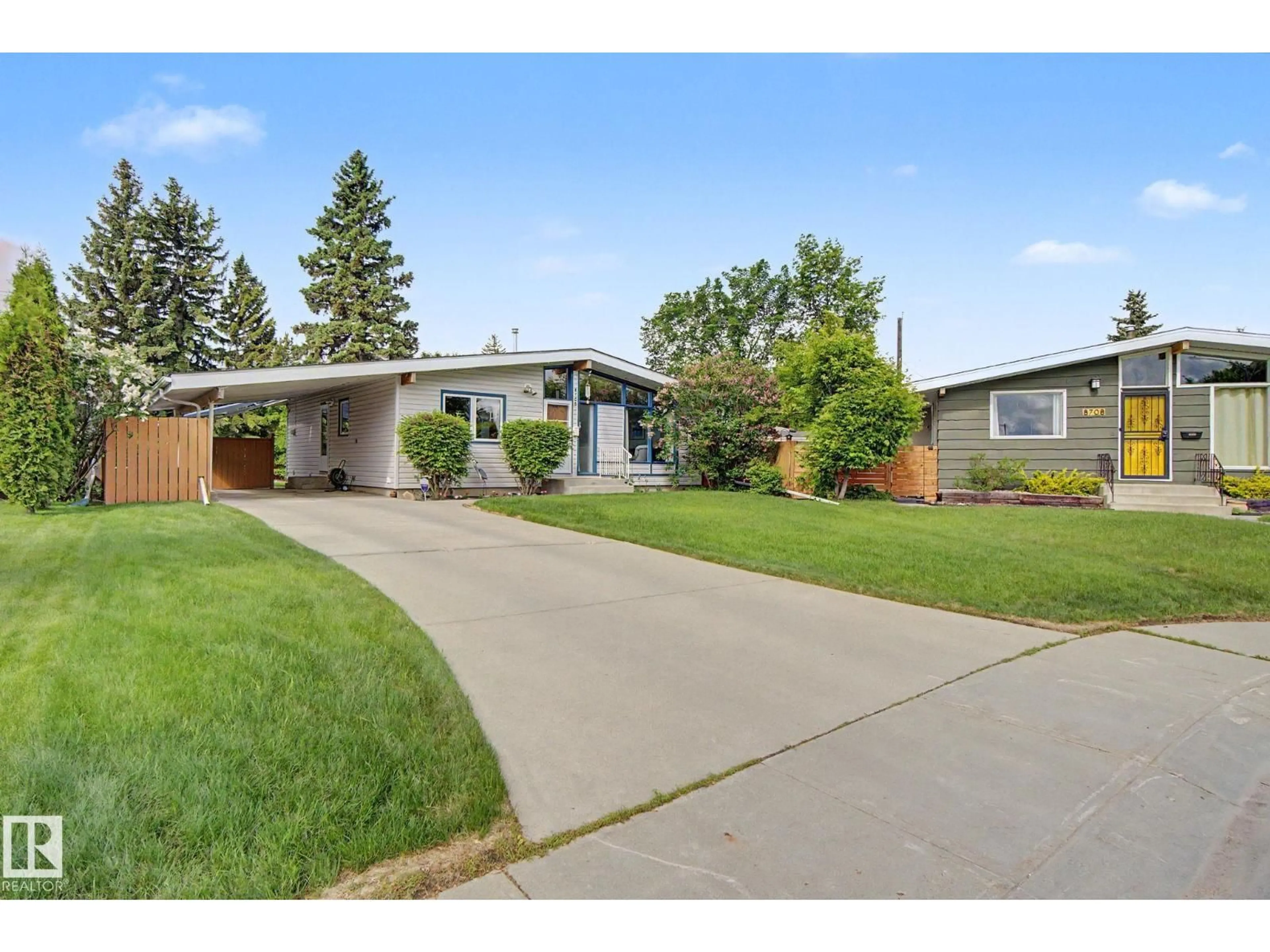 Home with vinyl exterior material, street for NW - 8706 162 ST, Edmonton Alberta T5R2M1