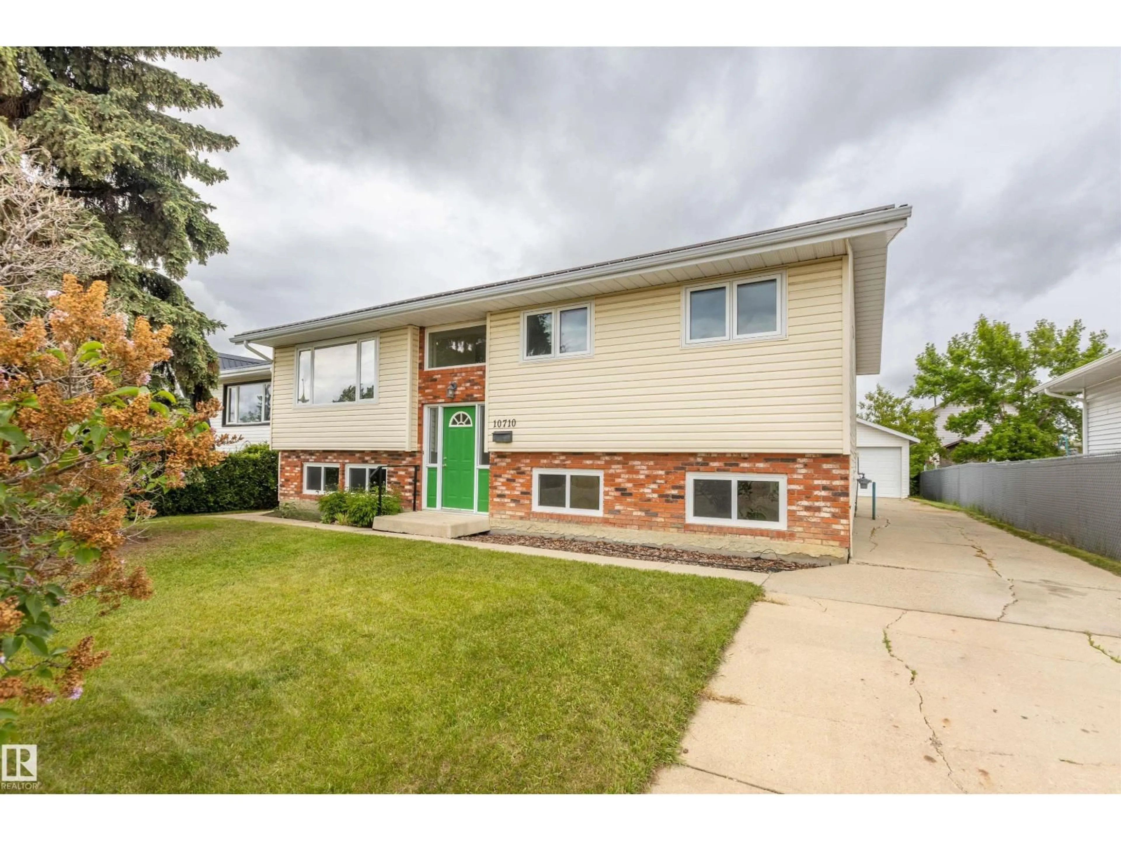 Home with vinyl exterior material, street for 10710 97 AV, Morinville Alberta T8R0E9