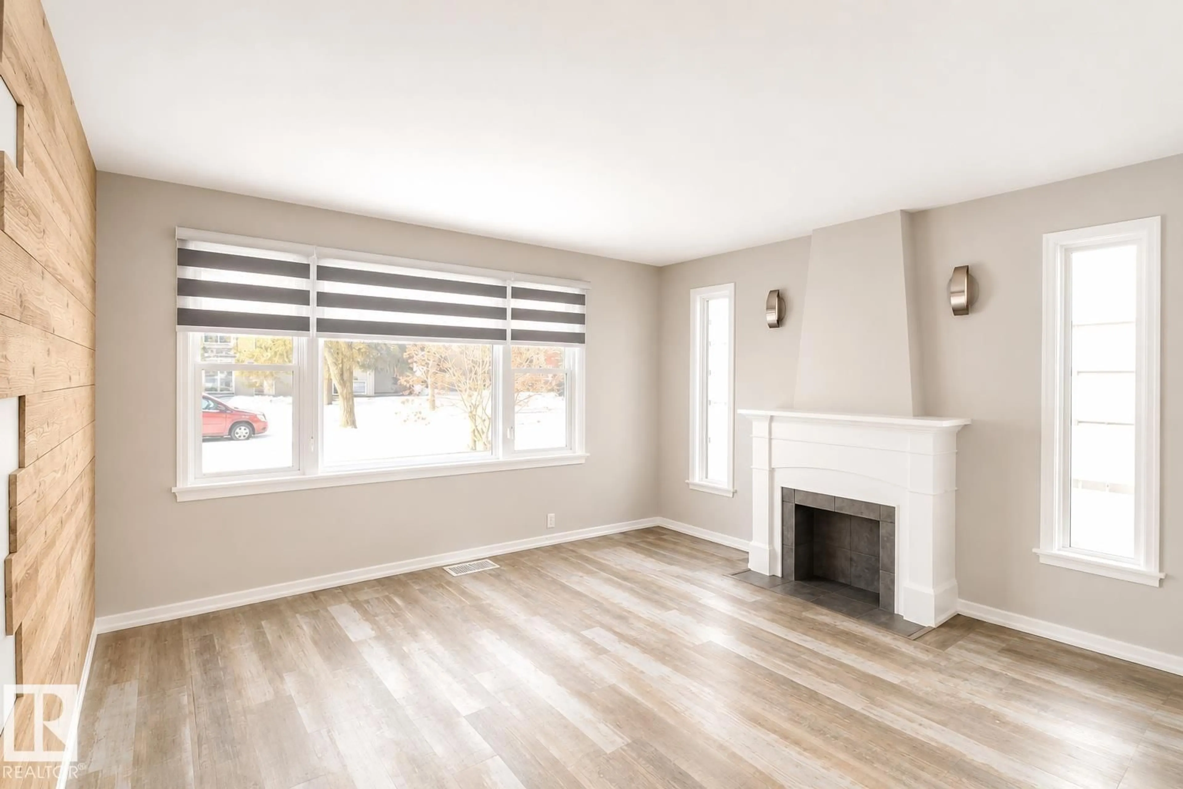 Living room with furniture, wood/laminate floor for 10815 112 ST, Edmonton Alberta T5H3H4