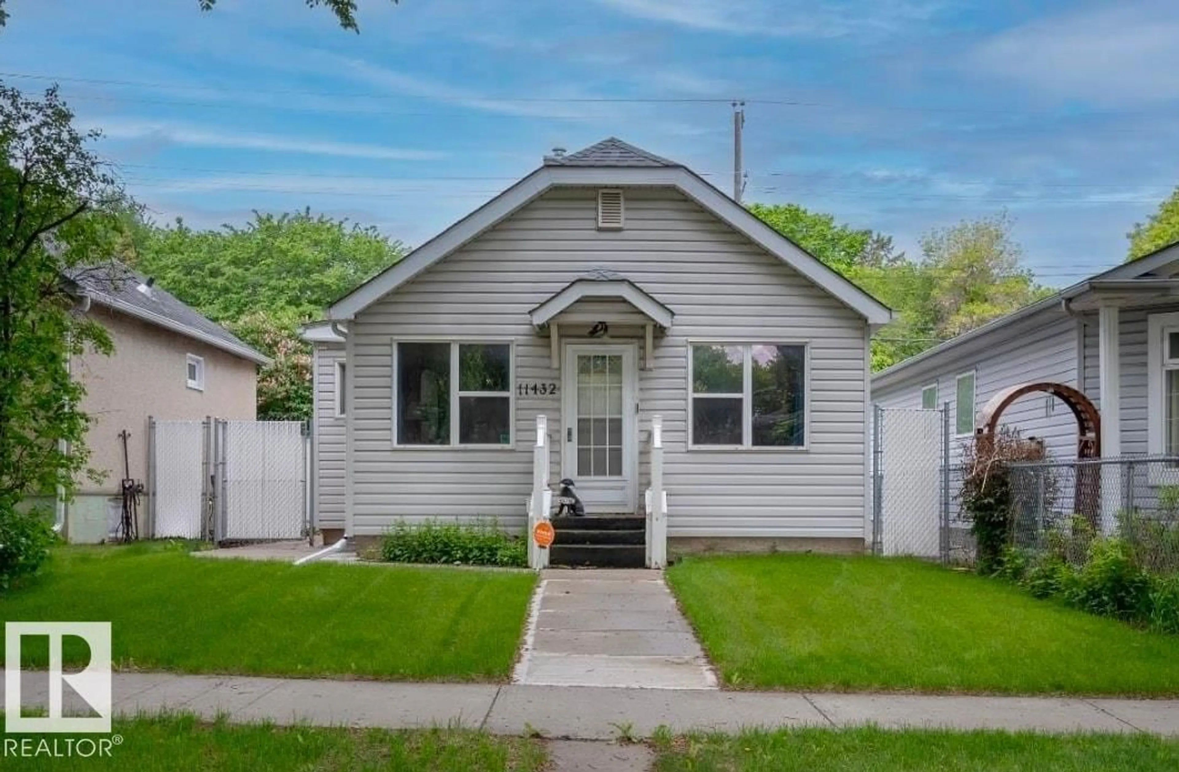 Home with vinyl exterior material, street for NW - 11432 84 ST, Edmonton Alberta T5B3B4